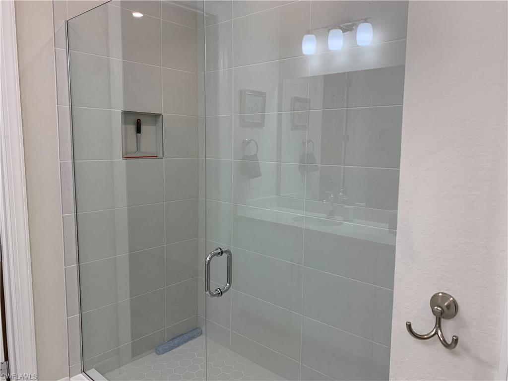 208 Indies Drive East, Unit 202 Naples, FL 34114 - Photo 21 of 48 a bathroom with a shower