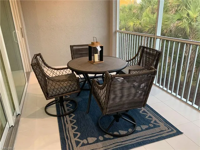 a view of a dining room with furniture wooden floor and windows