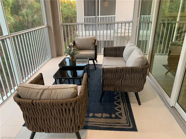 a view of balcony with furniture