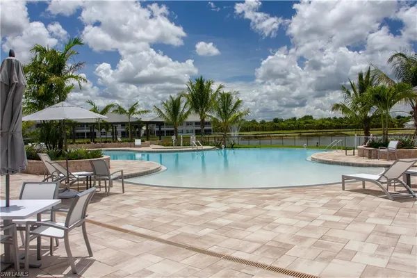 a view of a lake with a table and chairs