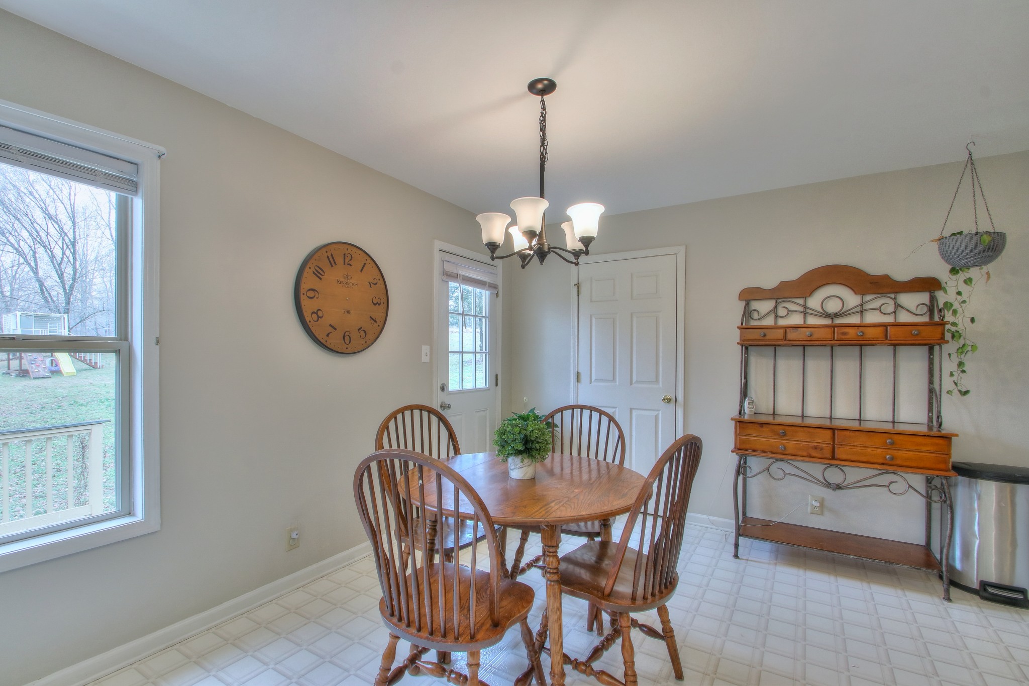 1006 Richland Trail Road Ashland City, TN 37015 - Photo 11 of 33 a dining room with furniture a rug and a chandelier
