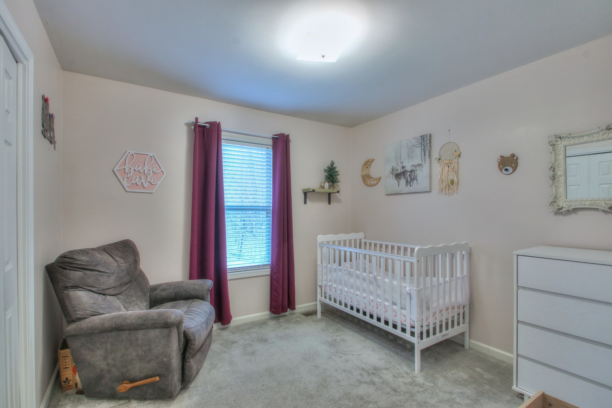 1006 Richland Trail Road Ashland City, TN 37015 - Photo 15 of 33 a living room with furniture a baby crib and a window