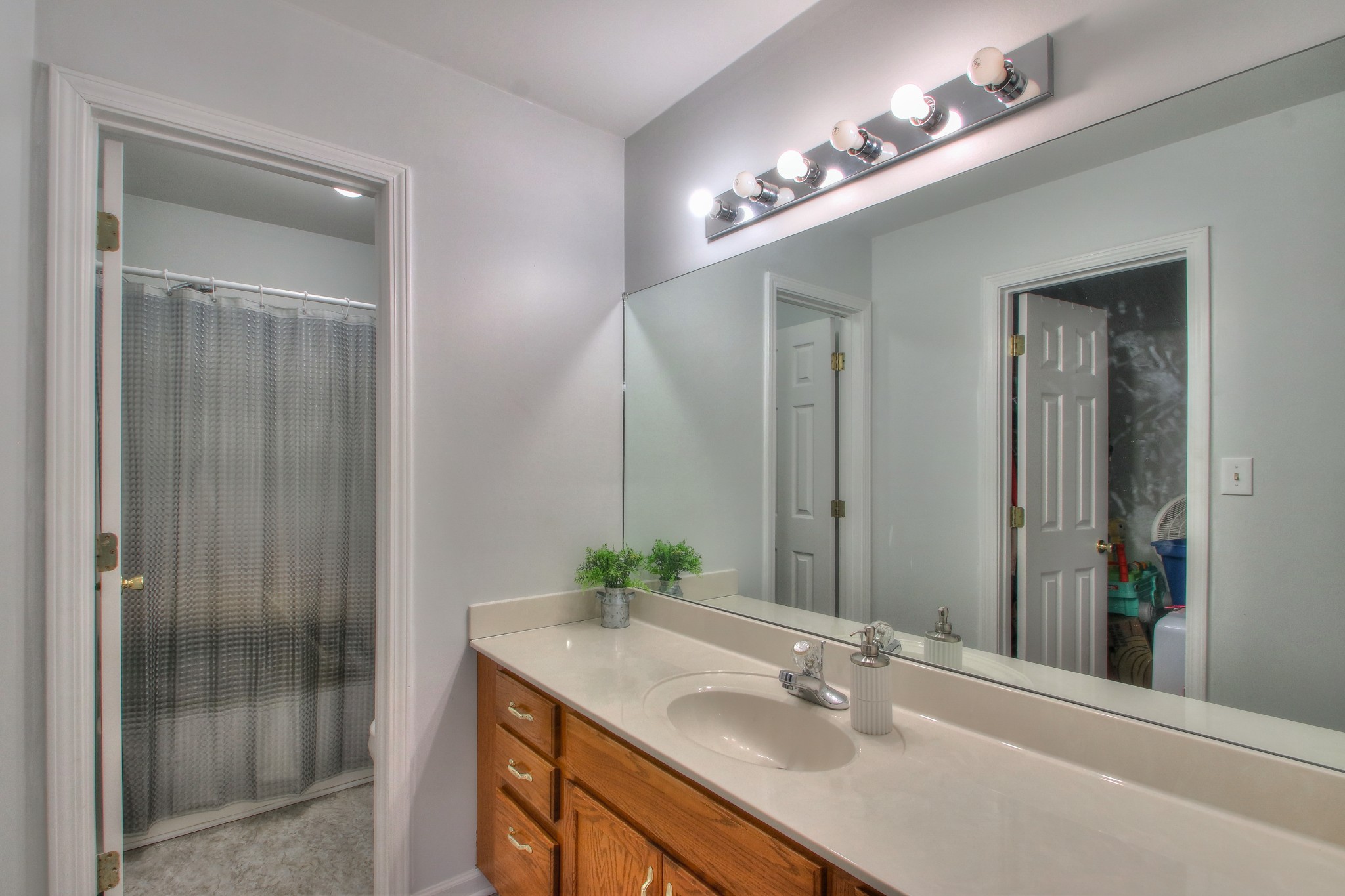 1006 Richland Trail Road Ashland City, TN 37015 - Photo 17 of 33 a bathroom with a sink double vanity and shower