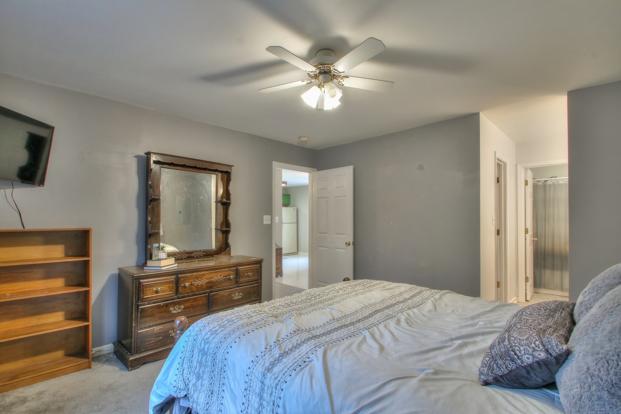 1006 Richland Trail Road Ashland City, TN 37015 - Photo 19 of 33 a bedroom with a bed and a flat screen tv
