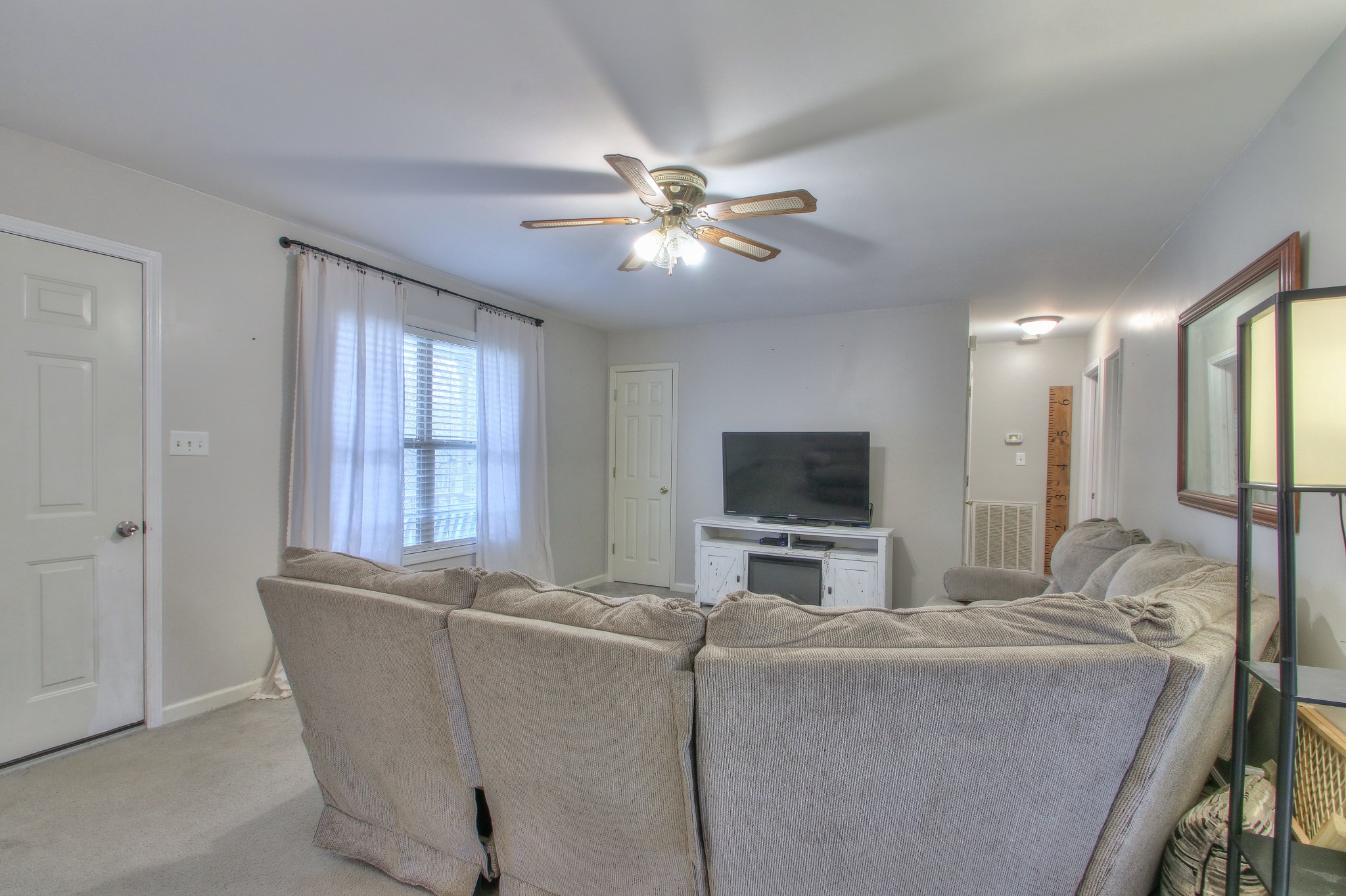 1006 Richland Trail Road Ashland City, TN 37015 - Photo 5 of 33 a living room with furniture and a flat screen tv