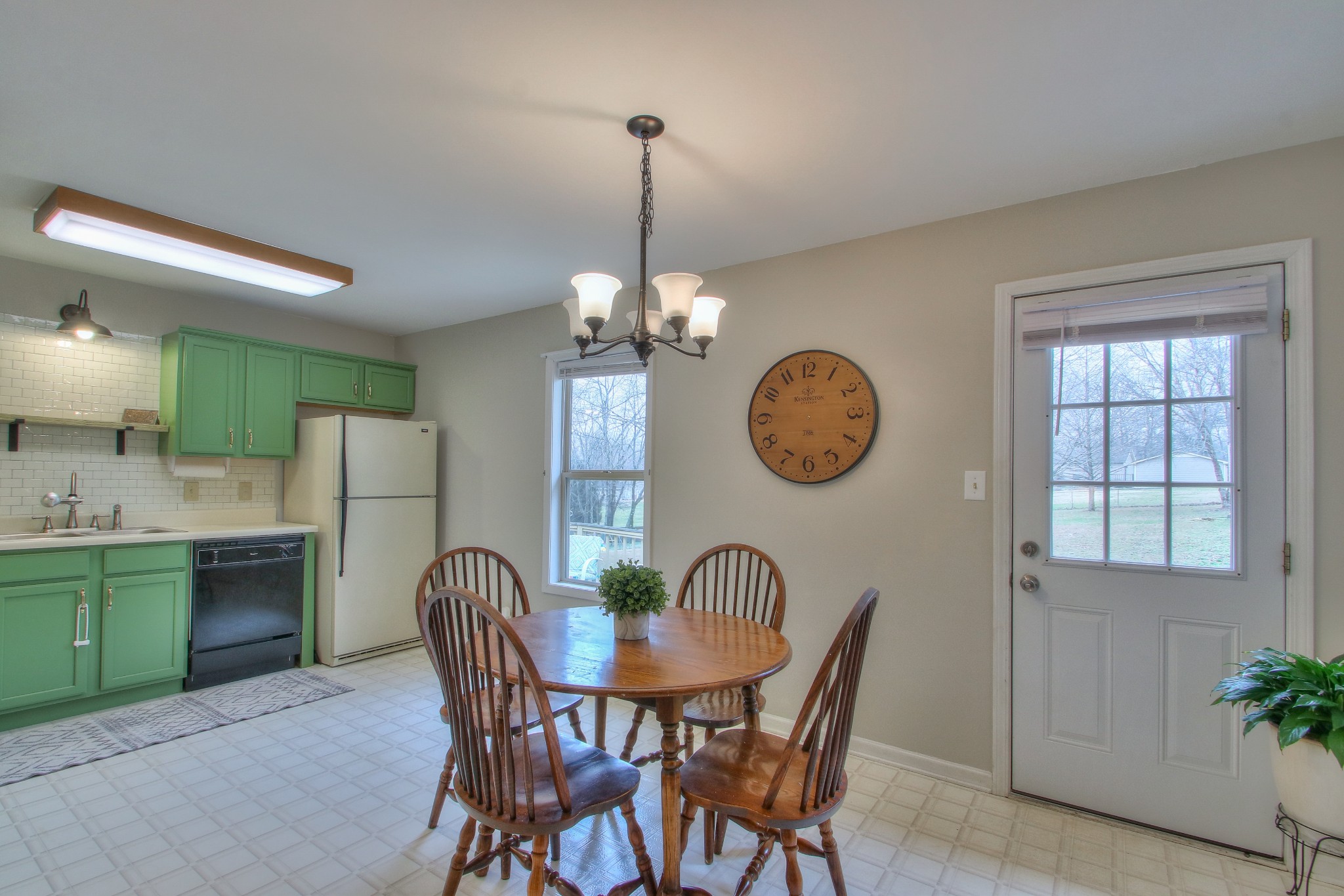 1006 Richland Trail Road Ashland City, TN 37015 - Photo 6 of 33 a dining room filled chandelier and kitchen view