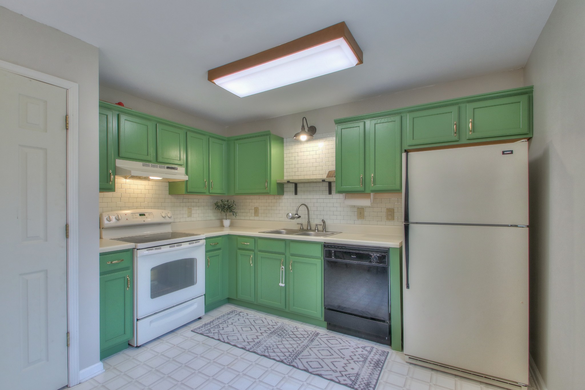 1006 Richland Trail Road Ashland City, TN 37015 - Photo 8 of 33 a kitchen with kitchen island a sink stainless steel appliances and cabinets