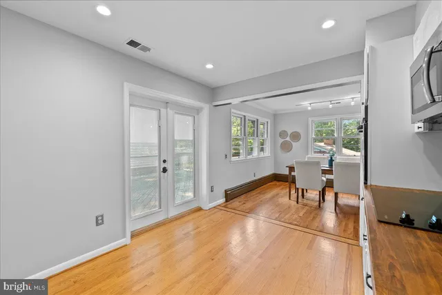 a view of a livingroom with furniture and a window