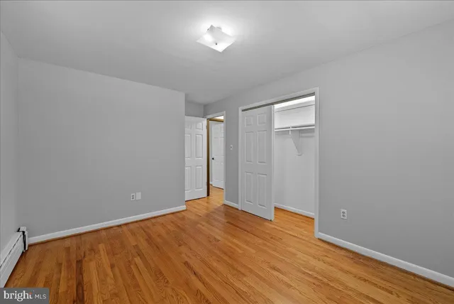 a view of room with wooden floor