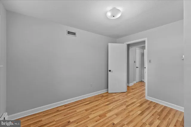 a view of room with wooden floor