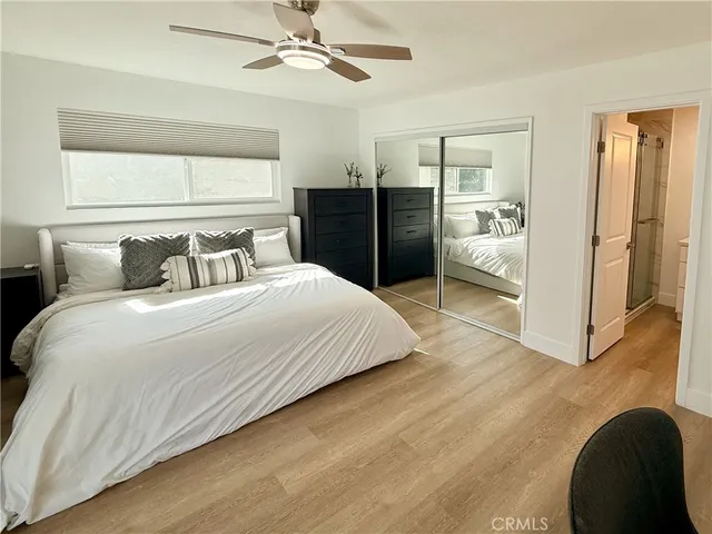 a bedroom with a bed and a walk in closet