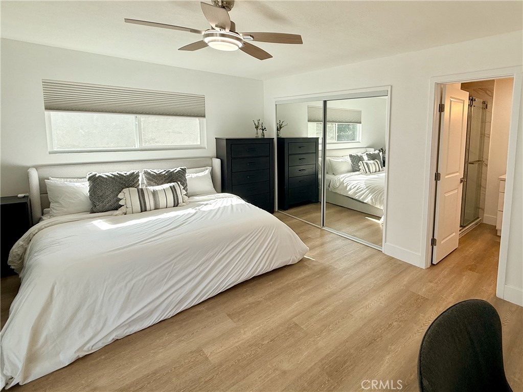 33932 Silver Lantern Street, Unit B Dana Point, CA 92629 - Photo 4 of 8 a bedroom with a bed and a walk in closet