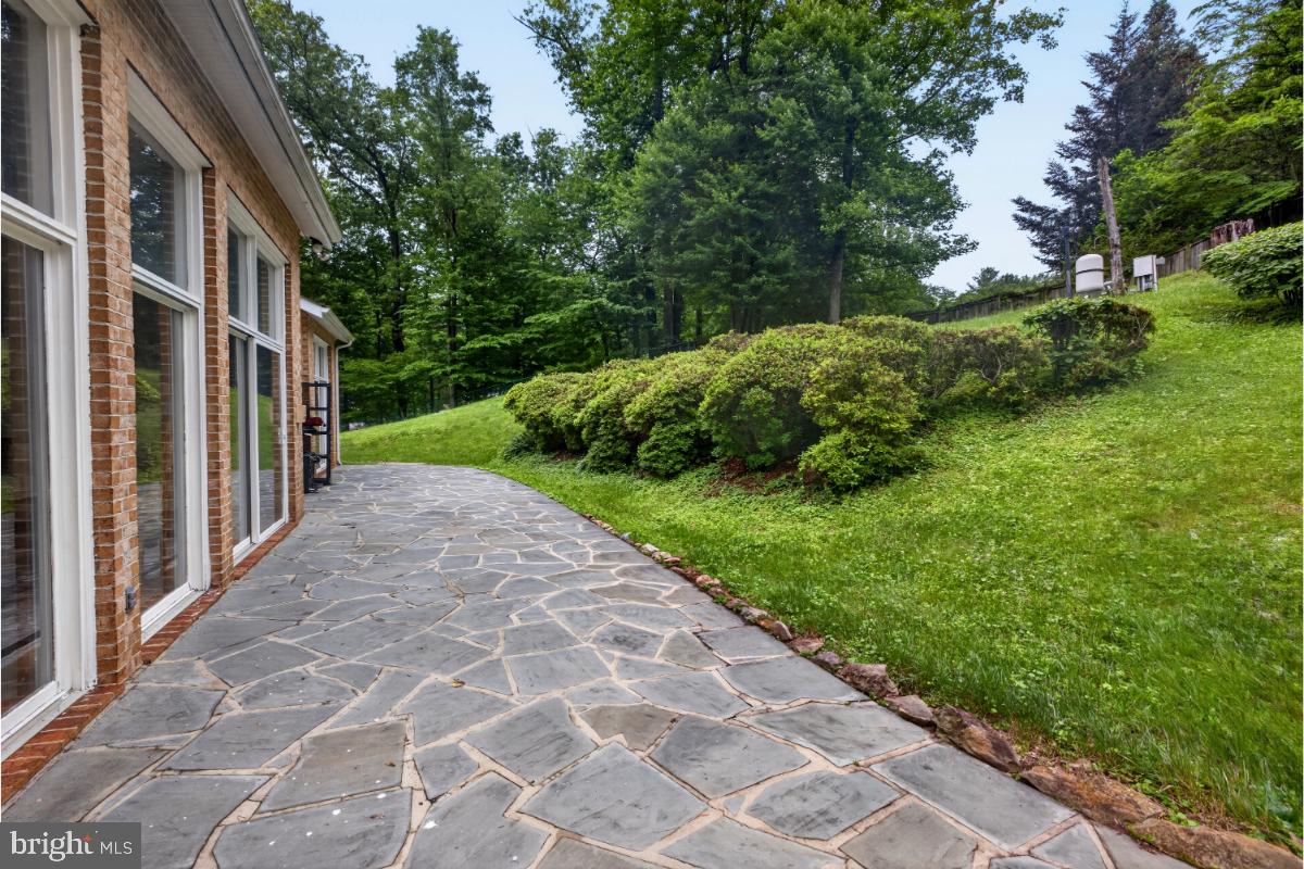 10320 Glen Road Potomac, MD 20854 - Photo 48 of 75 a view of a pathway both side of the house