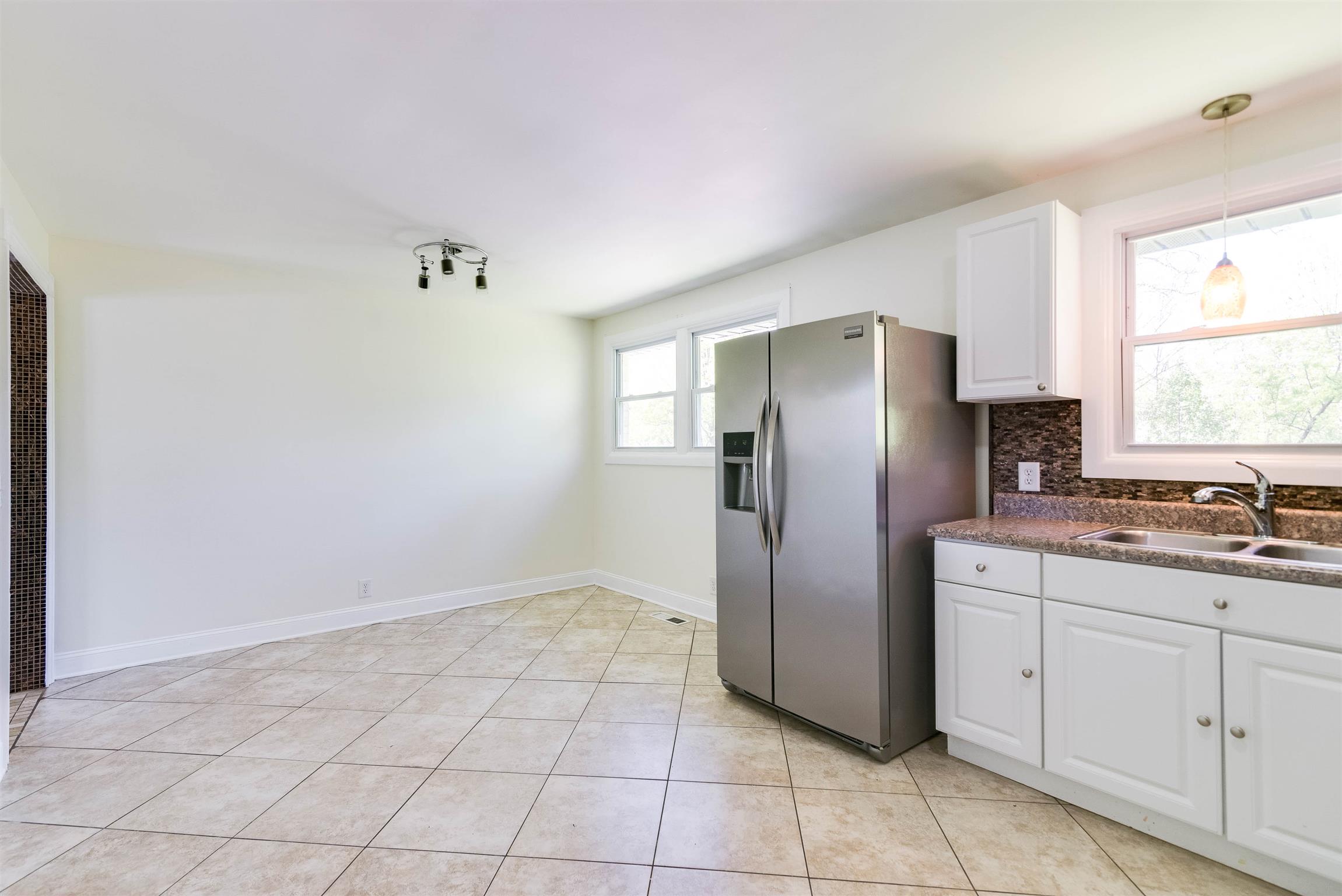 433 Cedarcliff Road Antioch, TN 37013 - Photo 13 of 30 Large eat-in kitchen with stainless steel appliances that will remain.