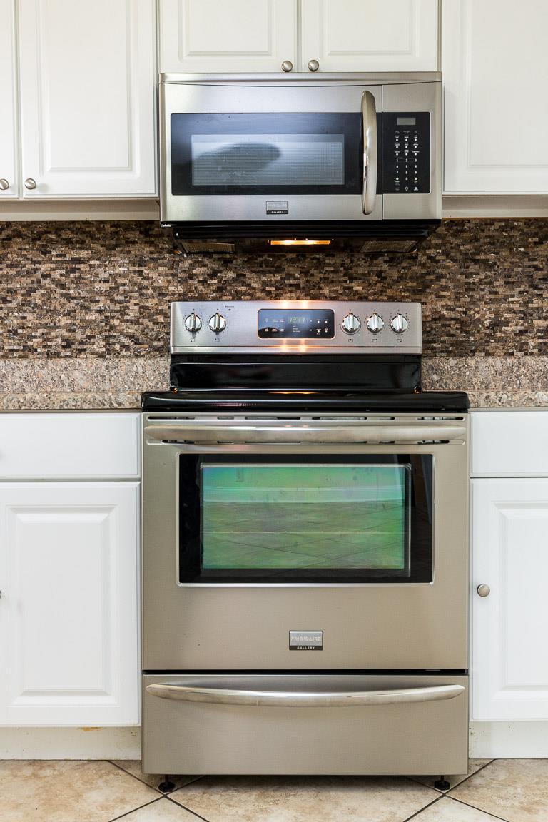 433 Cedarcliff Road Antioch, TN 37013 - Photo 16 of 30 Microwave and stove remain.