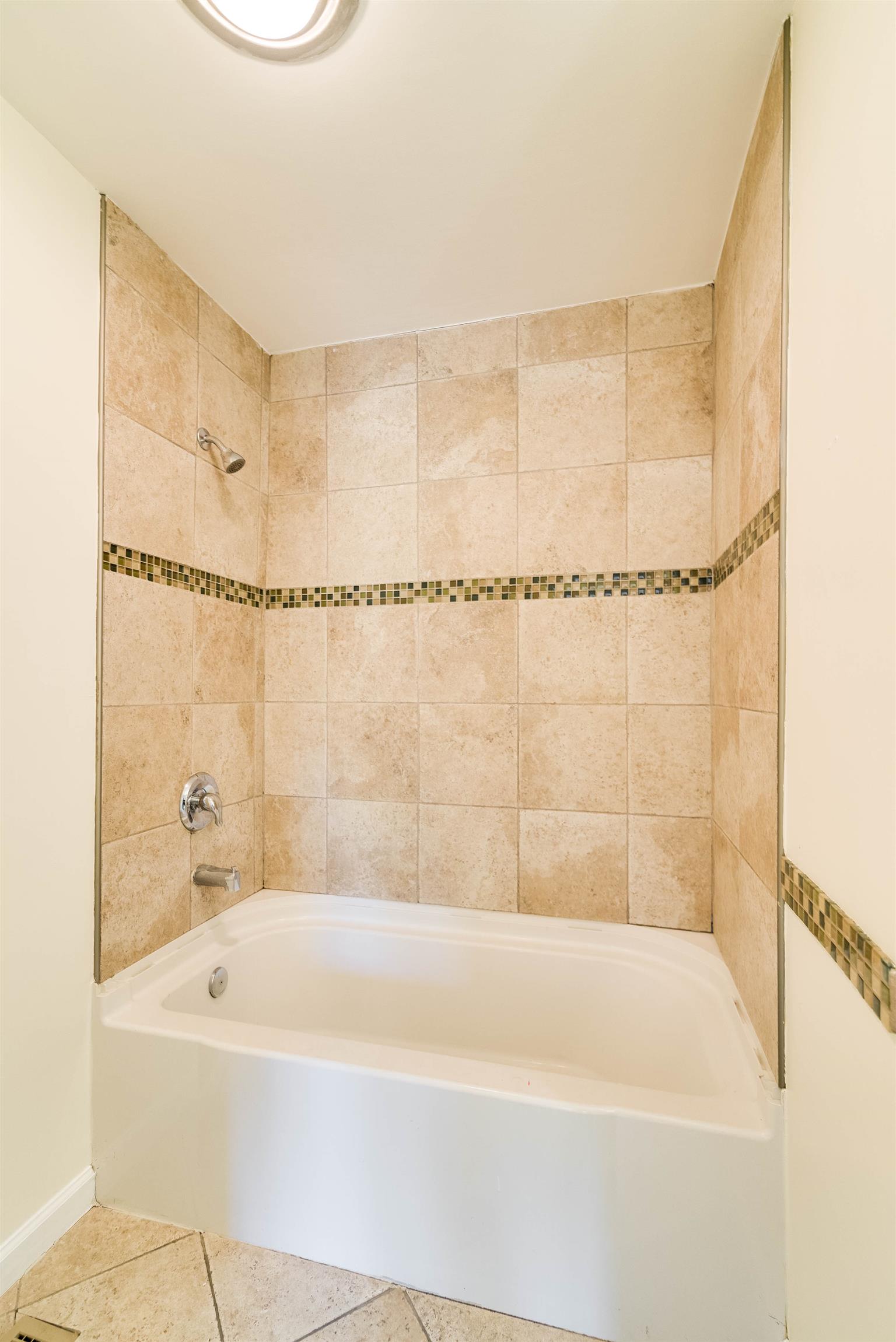 433 Cedarcliff Road Antioch, TN 37013 - Photo 19 of 30 Full bathroom in hall. Bathtub walls have been tiled.