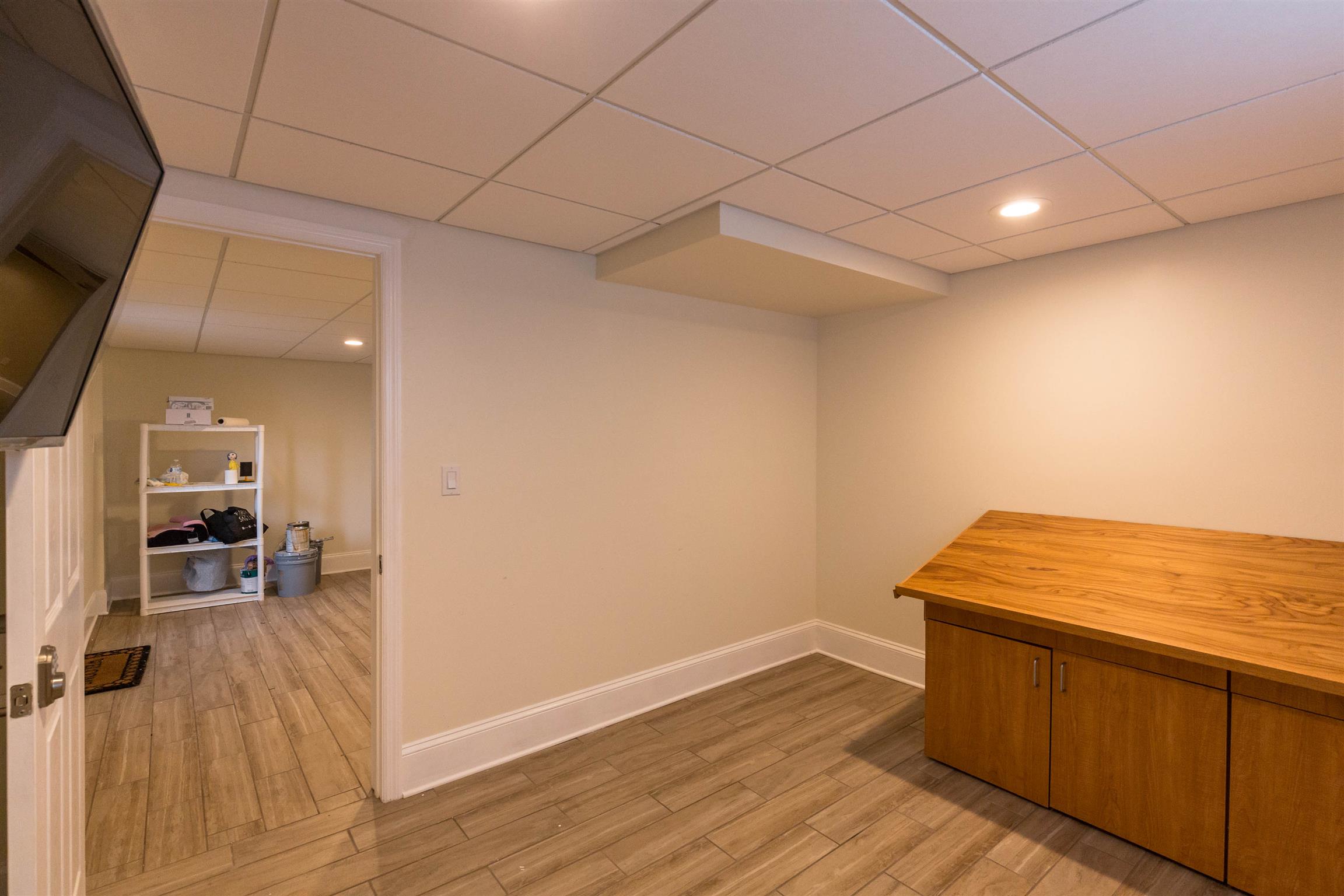 433 Cedarcliff Road Antioch, TN 37013 - Photo 25 of 30 Office downstairs. COuld be 5th bedroom. Currently has an architects desk and tv that will be removed.