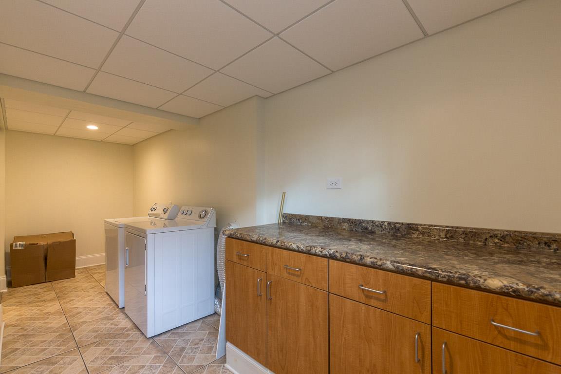 433 Cedarcliff Road Antioch, TN 37013 - Photo 27 of 30 Laundry room with laundry sink, large counter for folding clothes and holding household supplies. Washer and dryer remain!