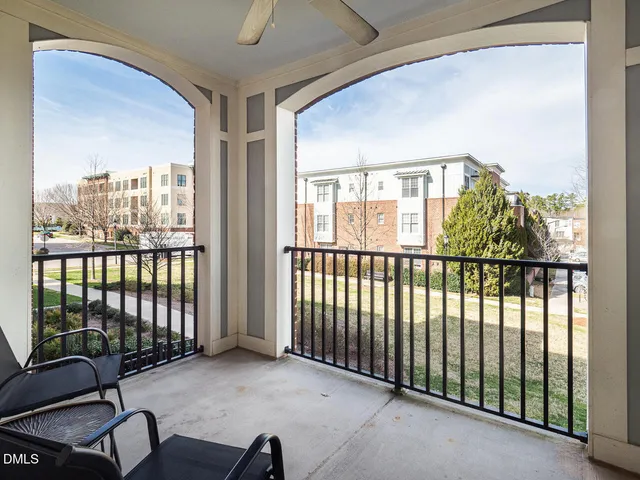 a view of a room with furniture and windows