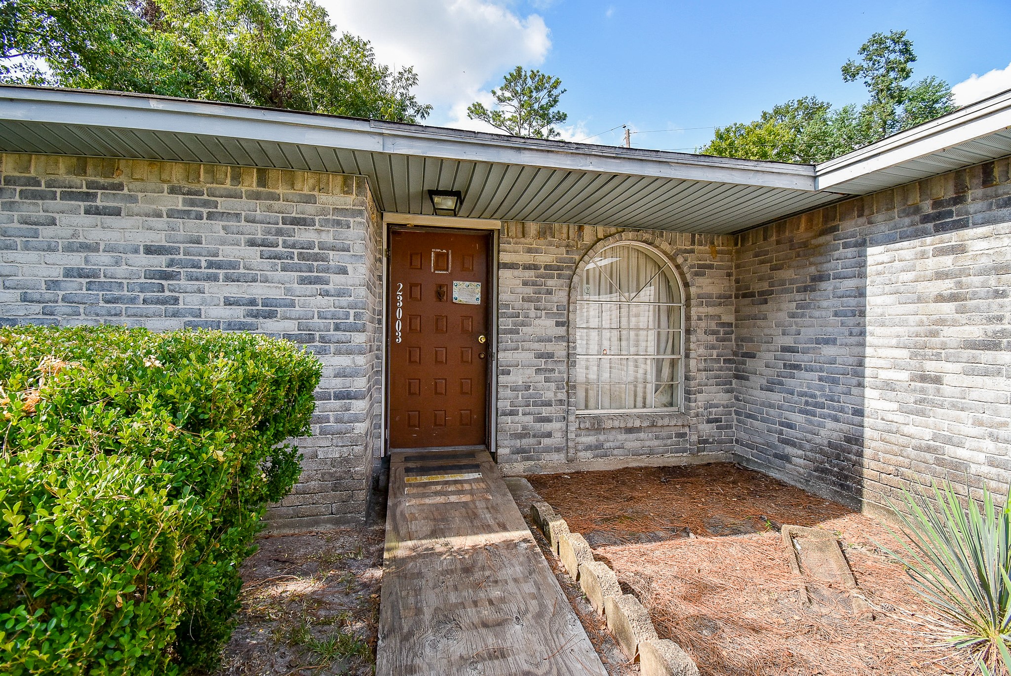 23003 Good Dale Lane Spring, TX 77373 - Photo 4 of 13 a front view of a house with a yard