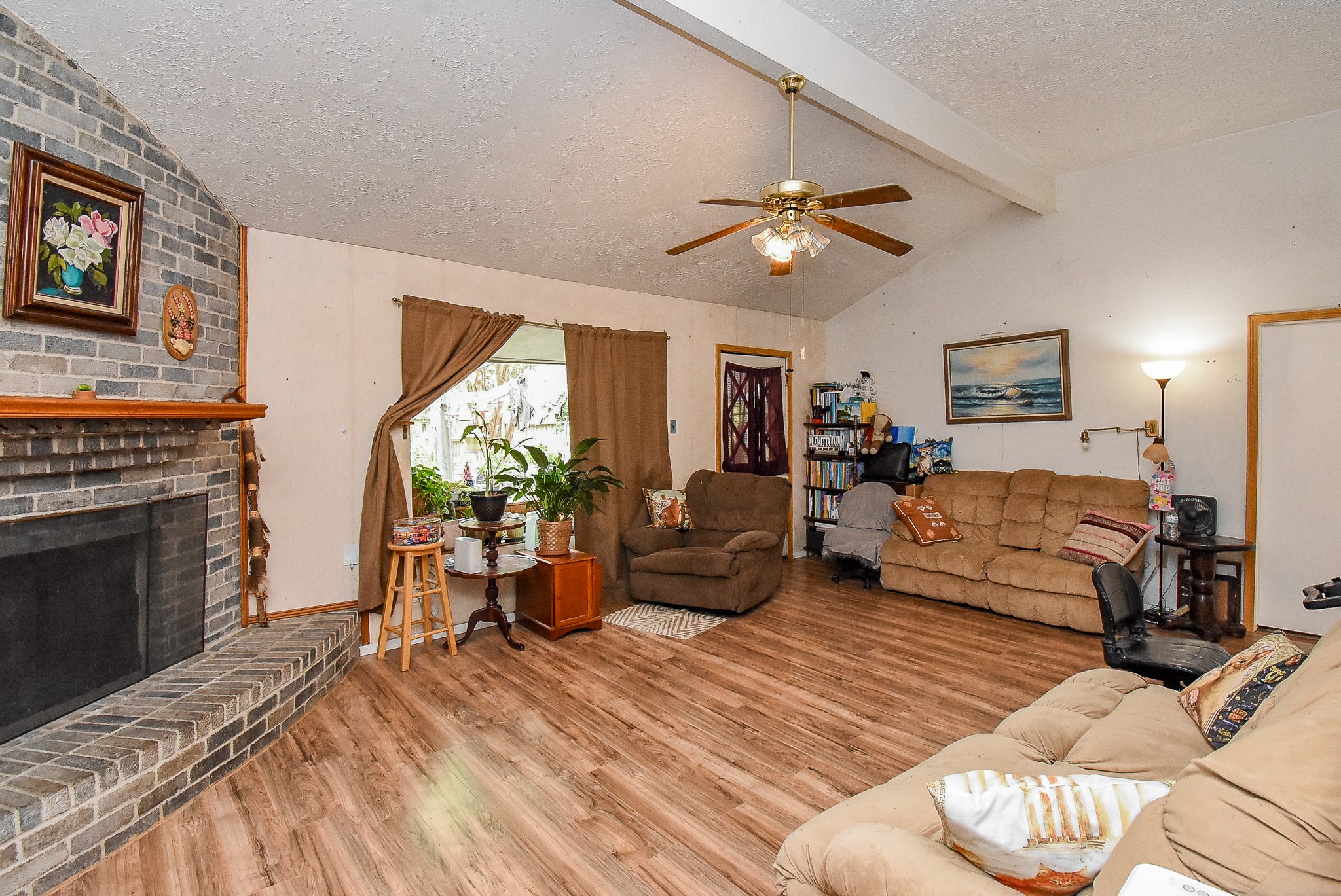 23003 Good Dale Lane Spring, TX 77373 - Photo 5 of 13 a living room with furniture or couch and a fireplace