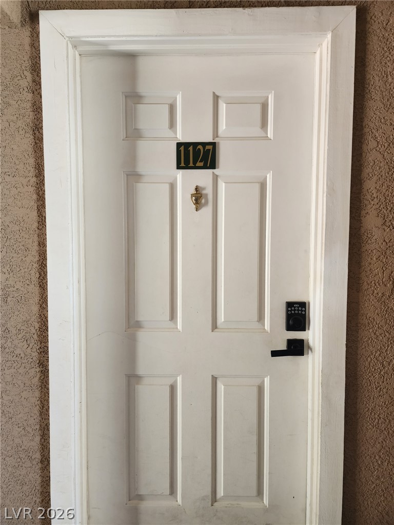 231 West Horizon Ridge Parkway, Unit 1127 Henderson, NV 89012 - Photo 28 of 39 Secure entry via a crisp white door, featuring a modern smart lock.