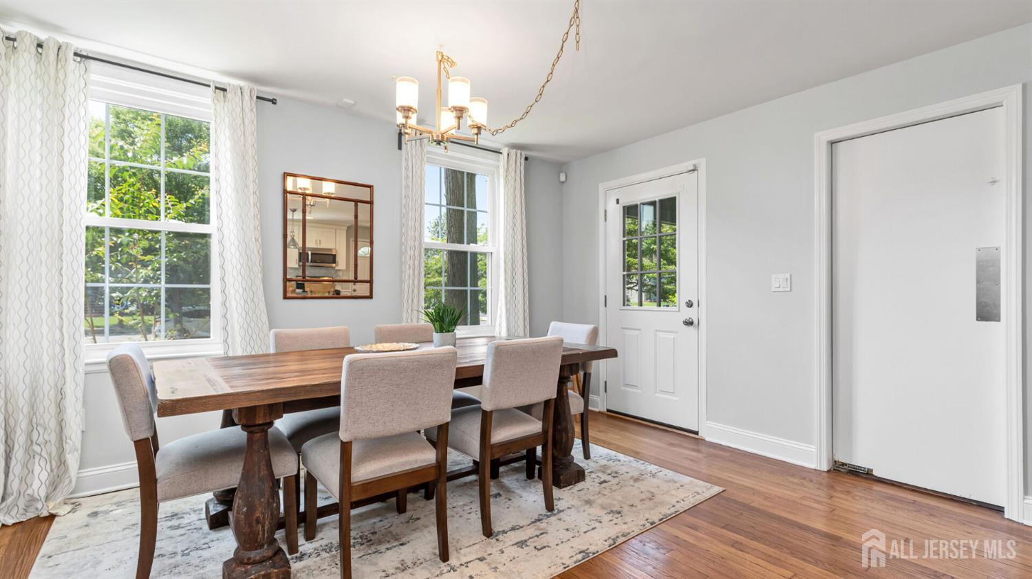 1085 Kenyon Avenue Plainfield, NJ 07060 - Photo 12 of 50 a view of a dining room with furniture a chandelier and wooden floor