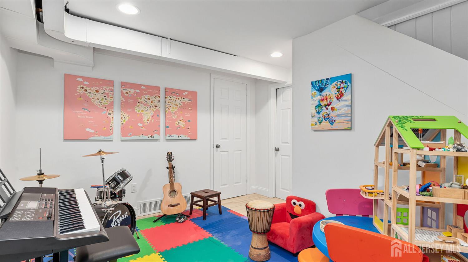 1085 Kenyon Avenue Plainfield, NJ 07060 - Photo 22 of 50 a room with furniture toys and a flat screen tv