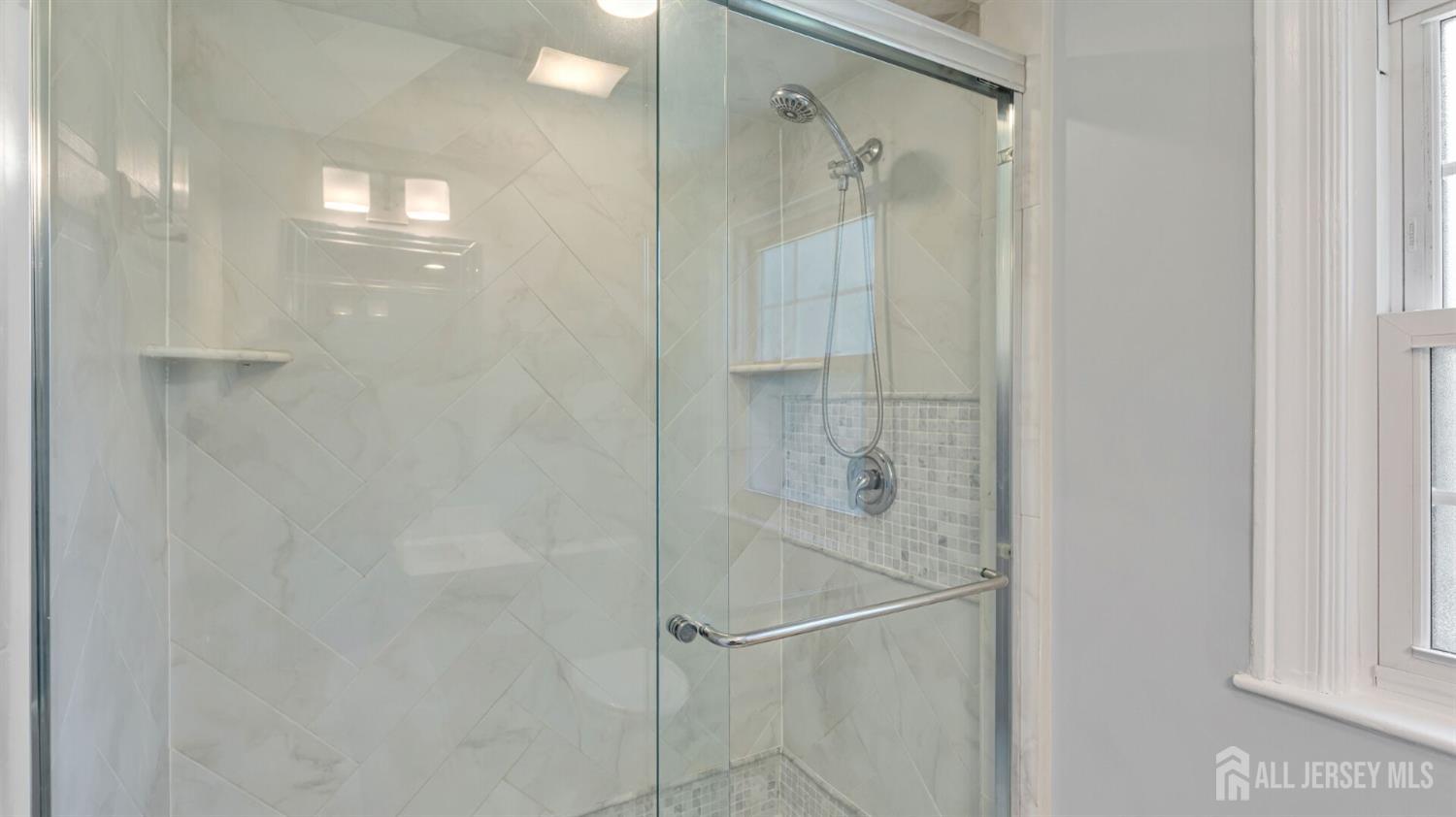 1085 Kenyon Avenue Plainfield, NJ 07060 - Photo 30 of 50 a bathroom with a glass shower door