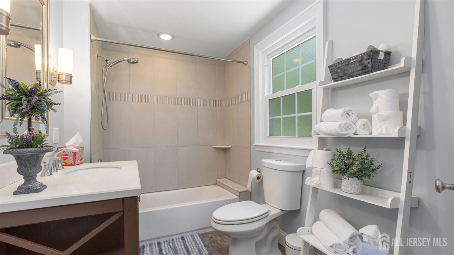 1085 Kenyon Avenue Plainfield, NJ 07060 - Photo 33 of 50 a bathroom with a sink toilet and shower