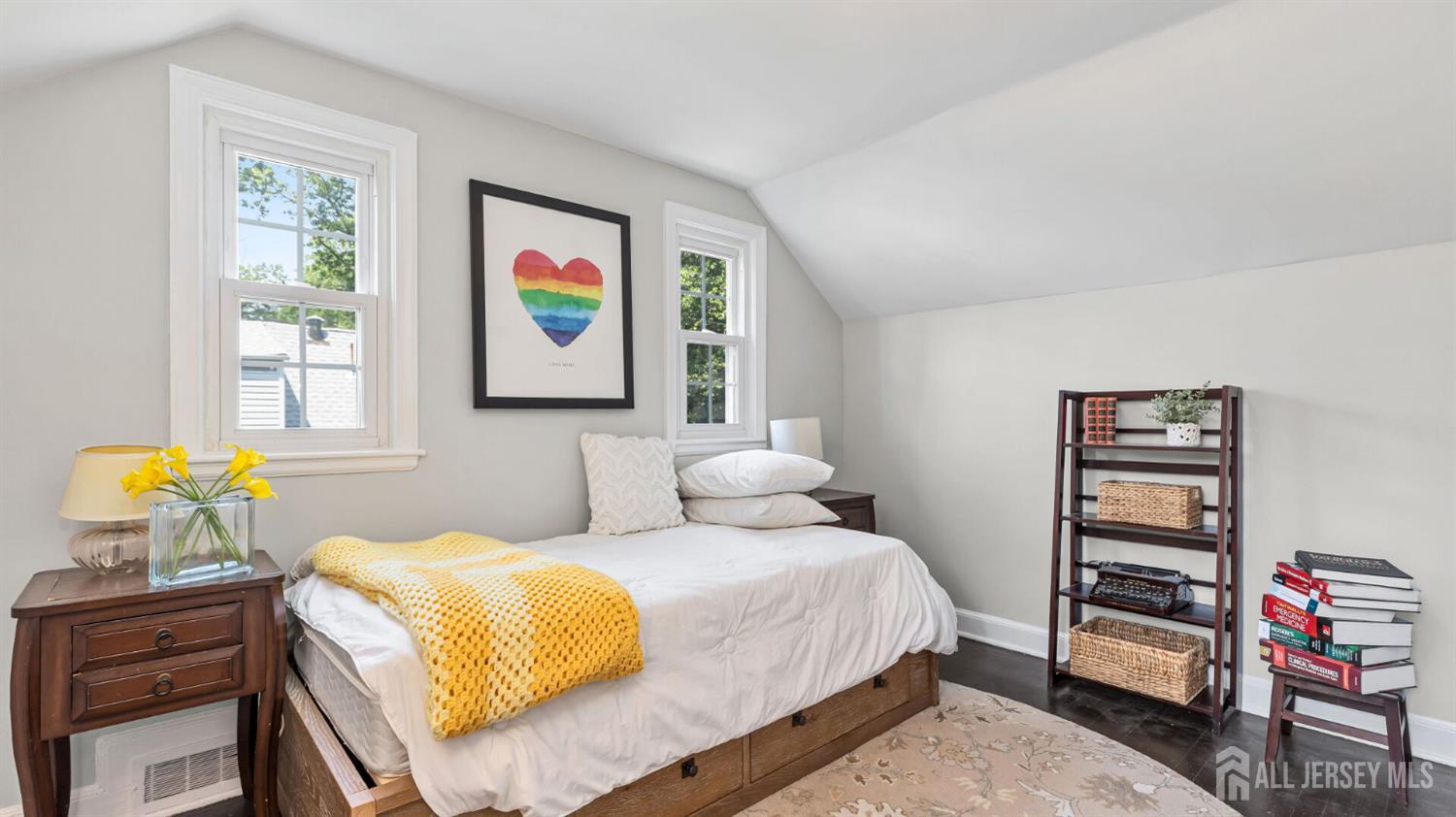 1085 Kenyon Avenue Plainfield, NJ 07060 - Photo 36 of 50 a bedroom with a bed a dresser and book shelf