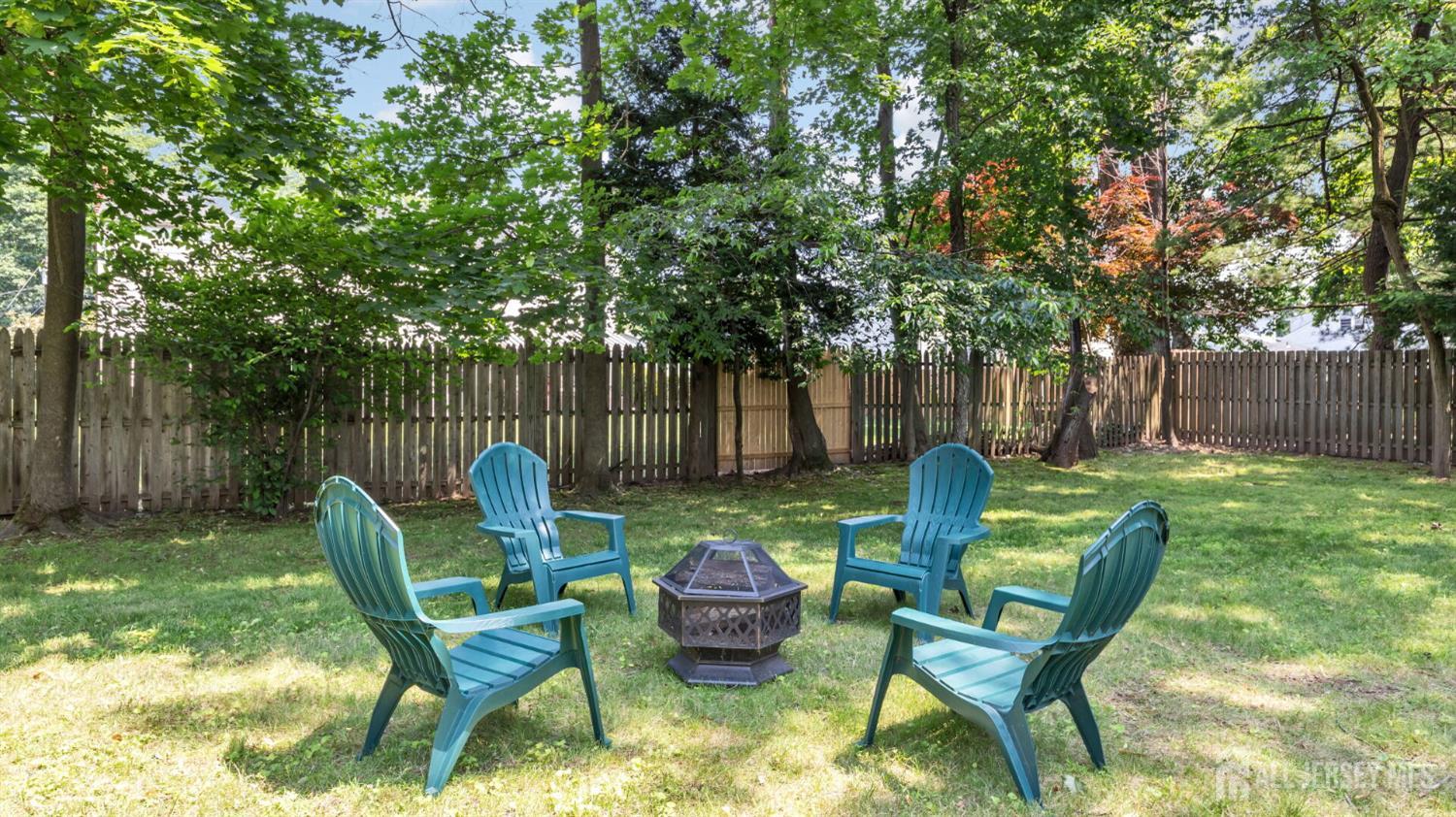1085 Kenyon Avenue Plainfield, NJ 07060 - Photo 39 of 50 a view of a chairs and table in backyard of the house