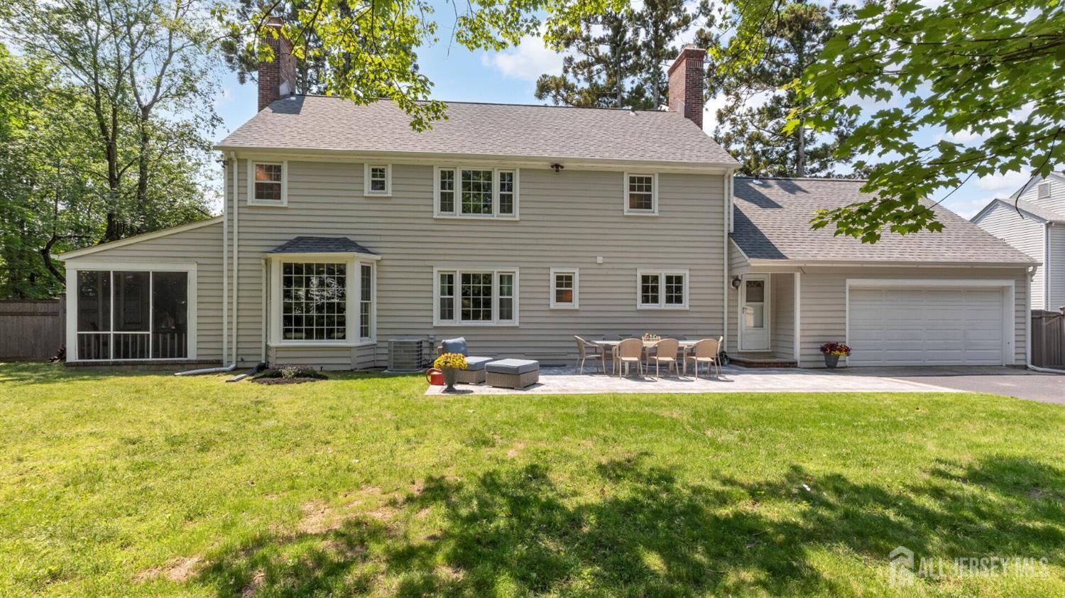 1085 Kenyon Avenue Plainfield, NJ 07060 - Photo 43 of 50 a house that has a big yard with large trees