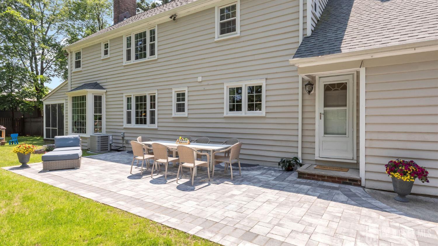 1085 Kenyon Avenue Plainfield, NJ 07060 - Photo 45 of 50 a view of a house with patio and a yard