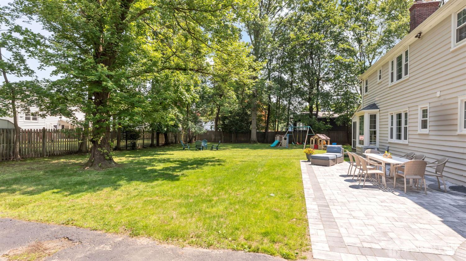 1085 Kenyon Avenue Plainfield, NJ 07060 - Photo 46 of 50 a view of a swimming pool with a table and chairs