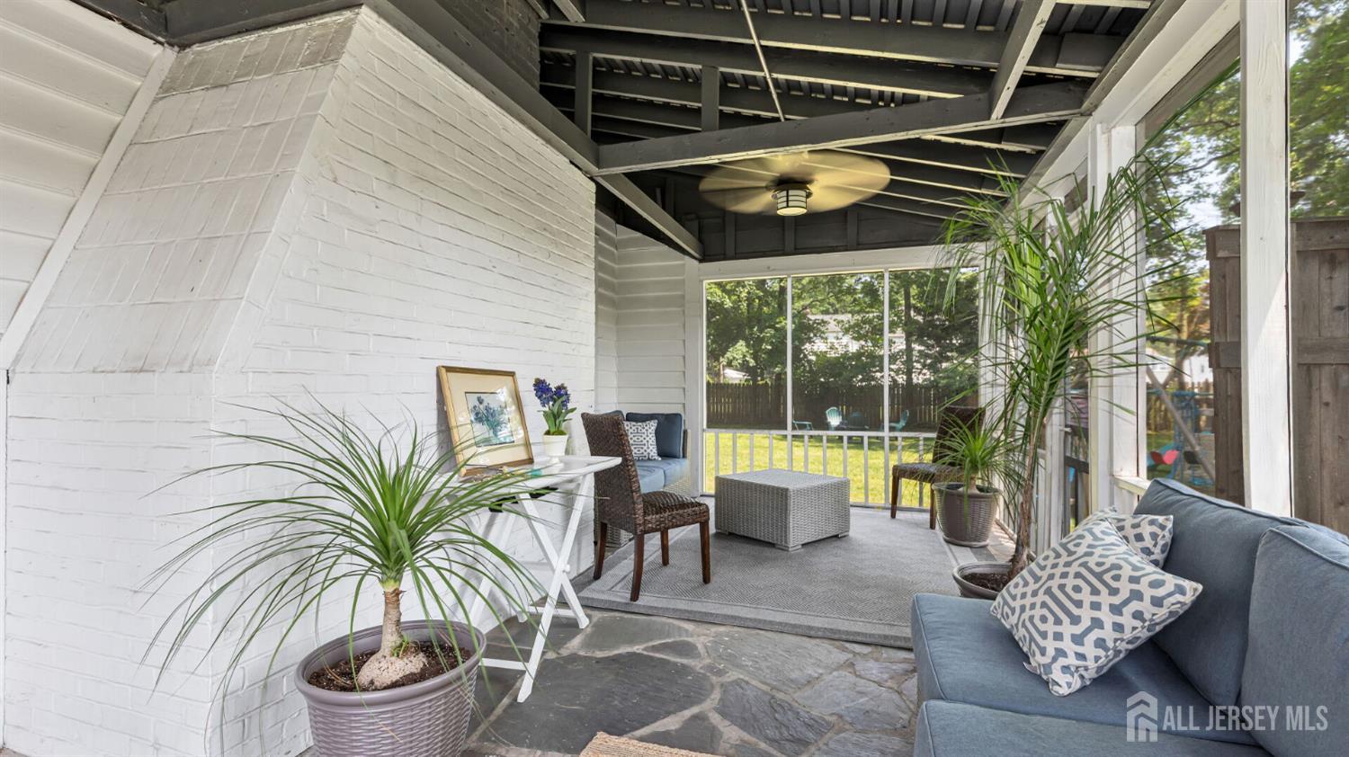 1085 Kenyon Avenue Plainfield, NJ 07060 - Photo 9 of 50 a view of a porch with furniture and a yard