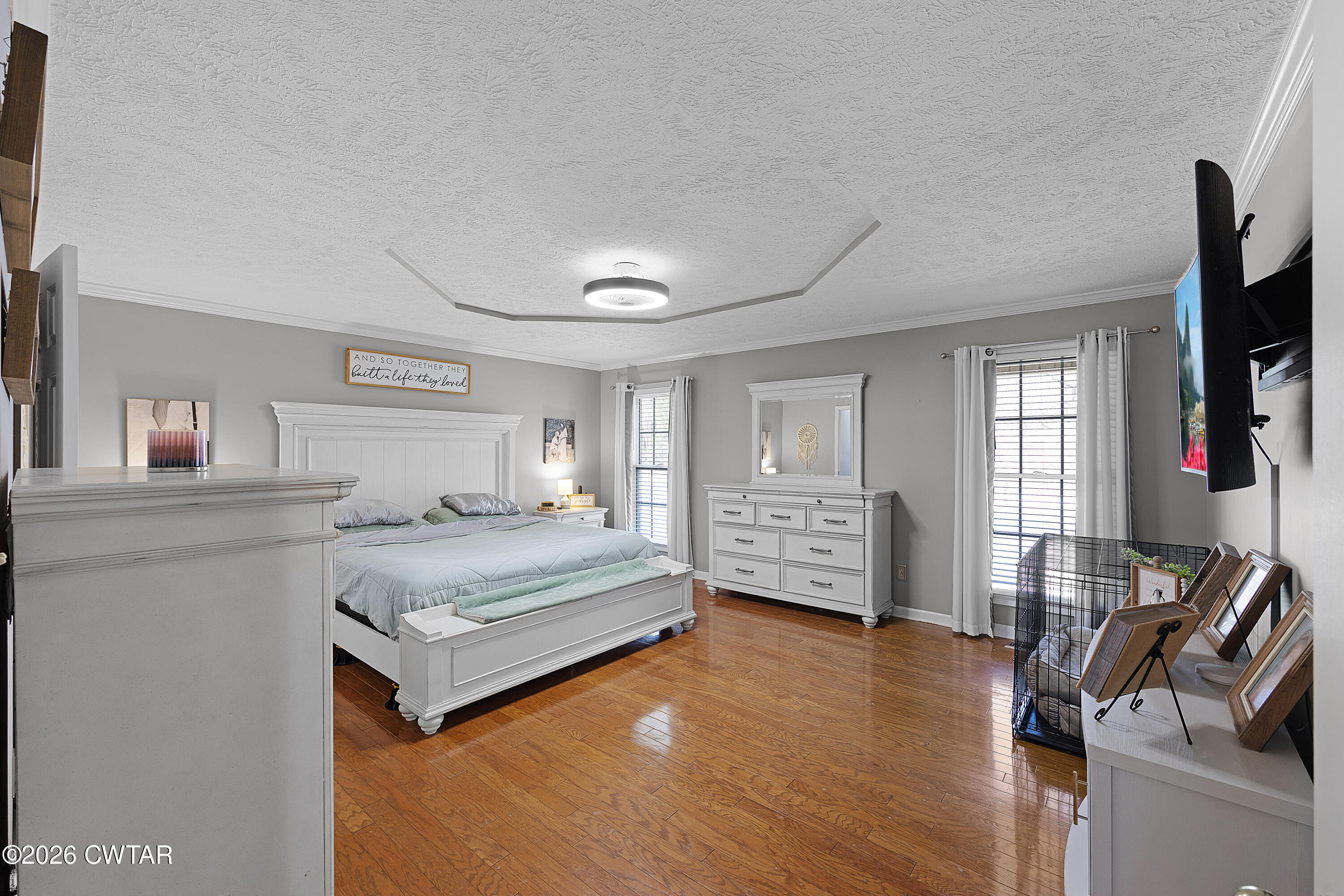 184 Deep Gap Road Jackson, TN 38301 - Photo 11 of 31 a bedroom with a bed and a flat screen television