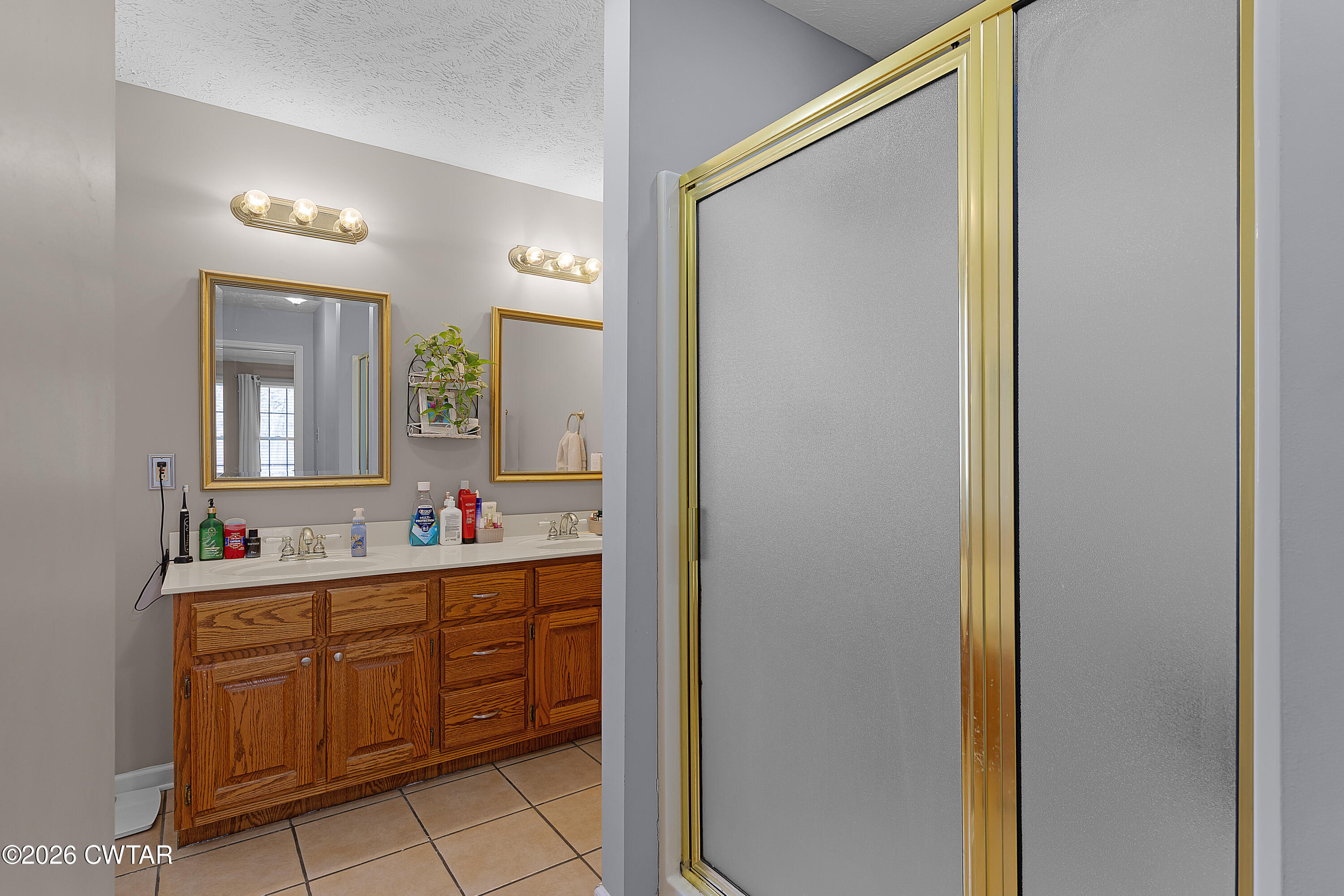 184 Deep Gap Road Jackson, TN 38301 - Photo 15 of 31 a bathroom with a sink and a mirror