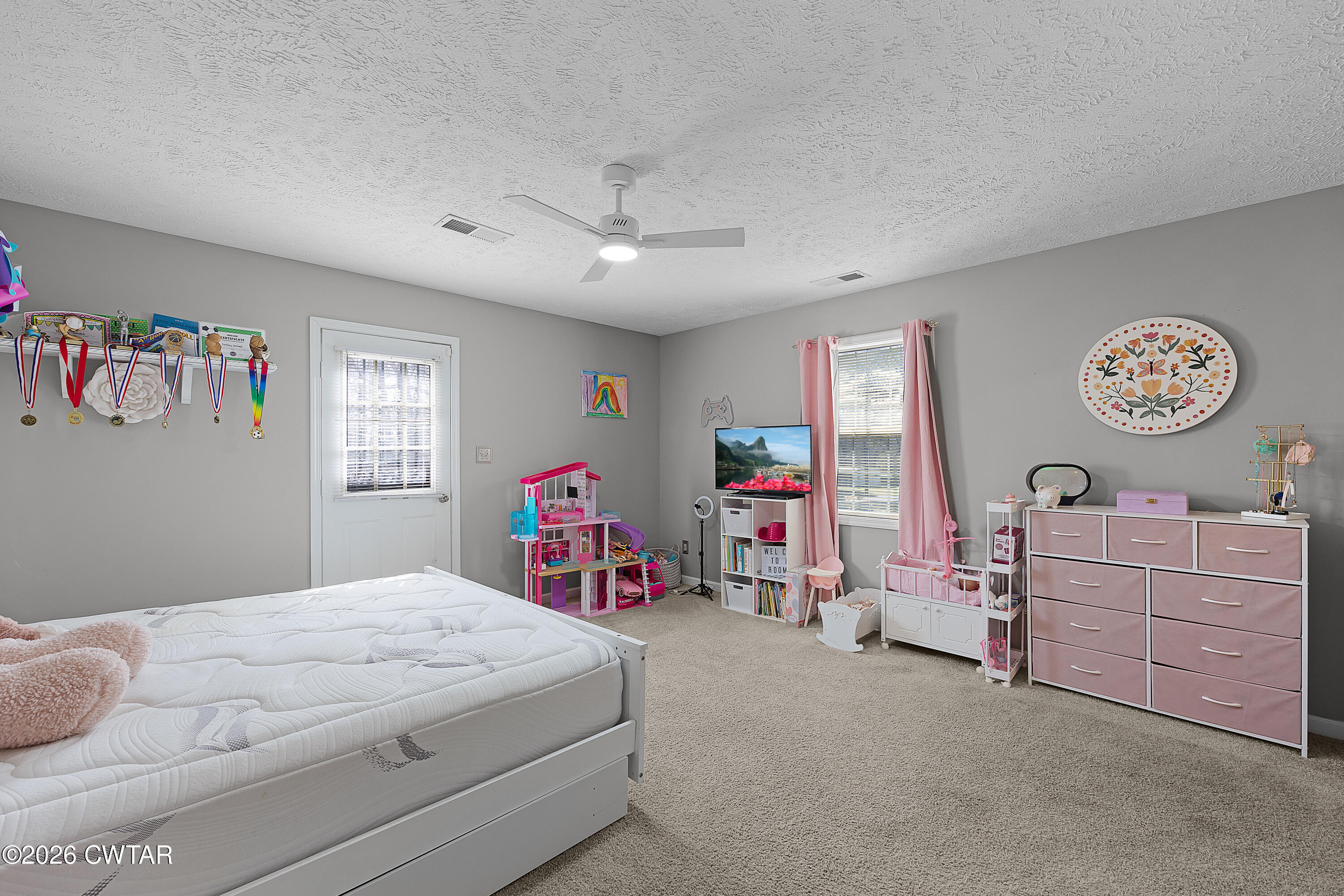184 Deep Gap Road Jackson, TN 38301 - Photo 23 of 31 a bedroom with a bed and cabinets
