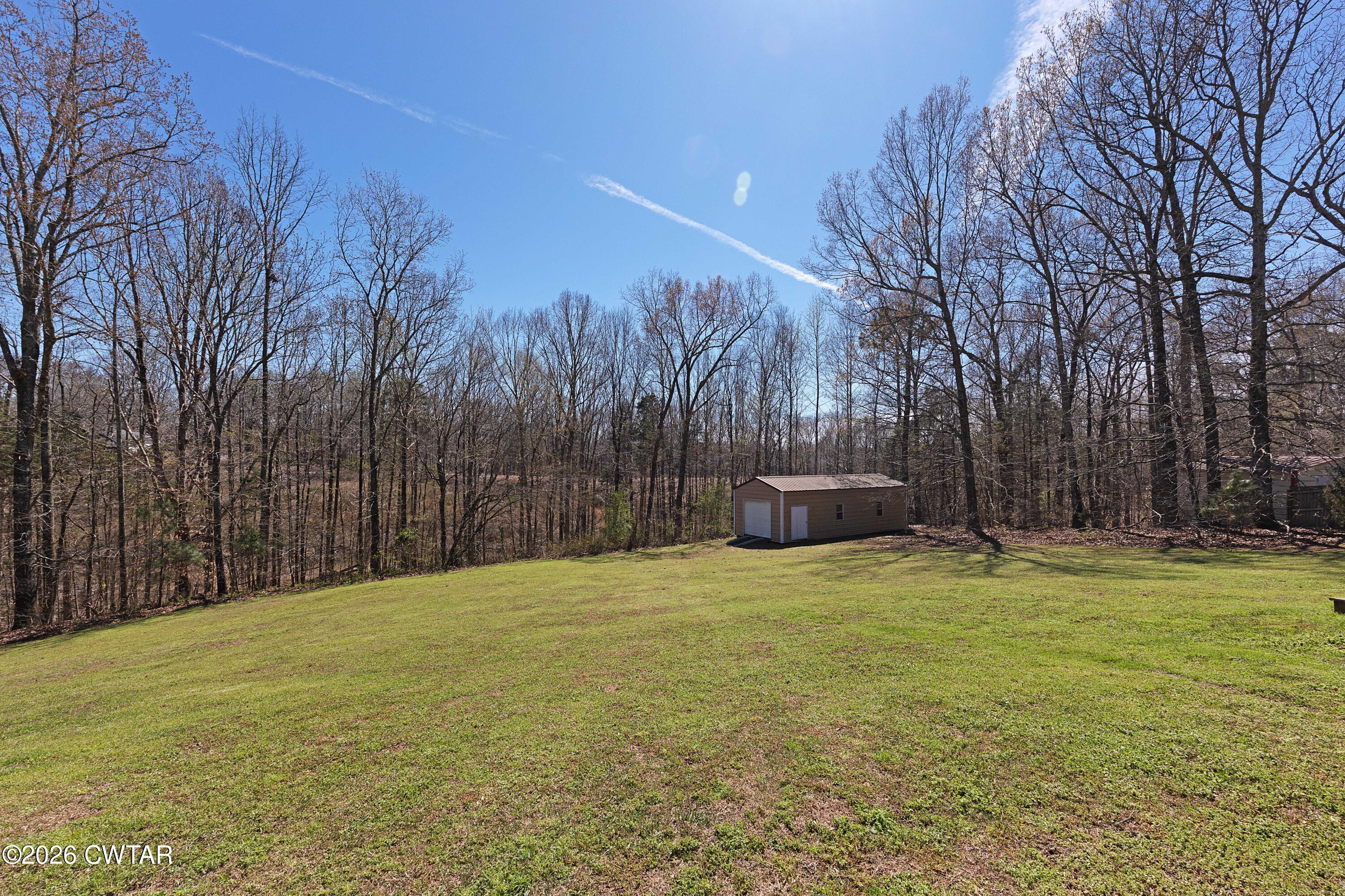 184 Deep Gap Road Jackson, TN 38301 - Photo 27 of 31 a view of a swimming pool with an outdoor space and seating area