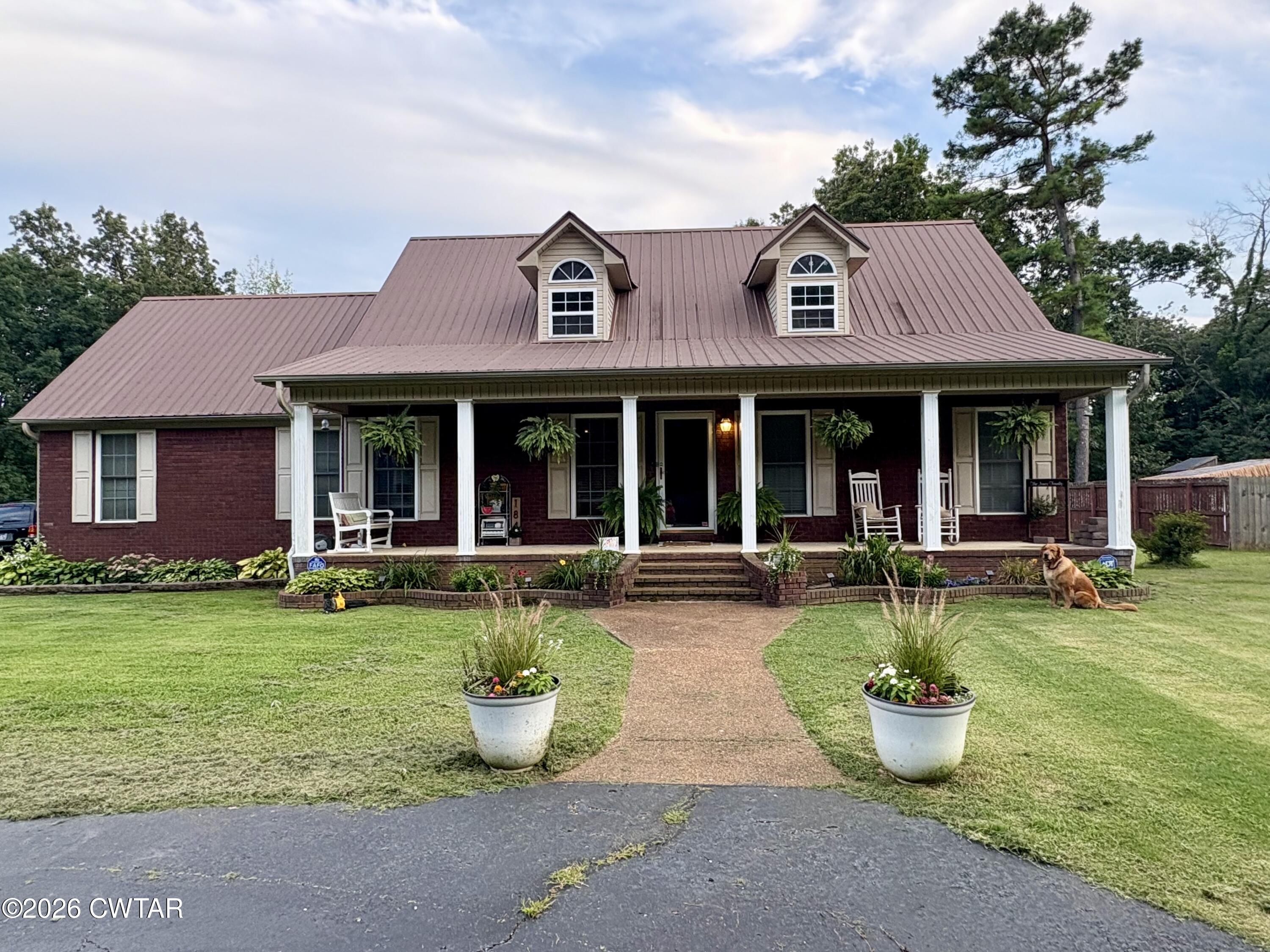 184 Deep Gap Road Jackson, TN 38301 - Photo 28 of 31 a front view of a house with swimming pool having outdoor seating