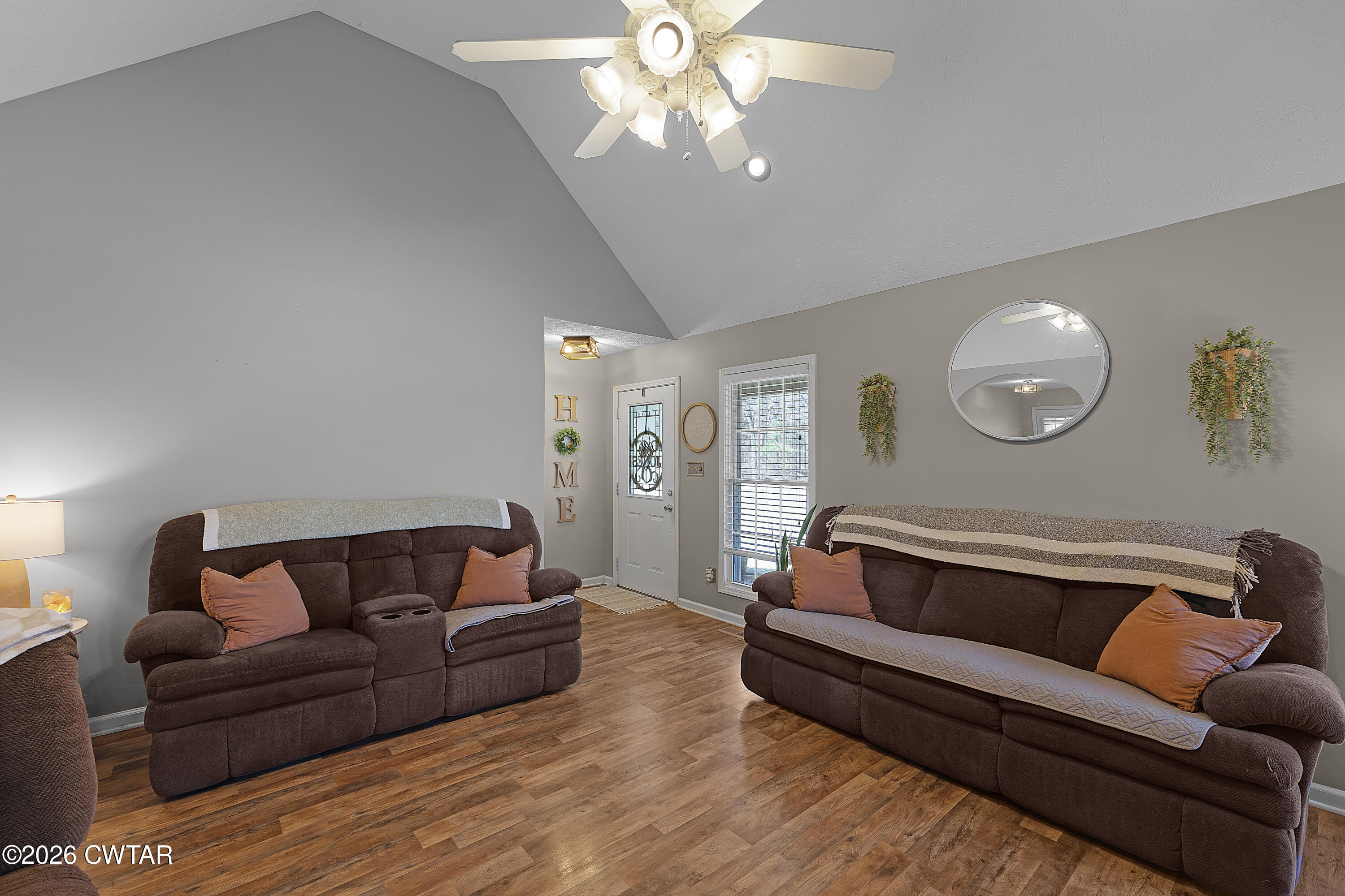 184 Deep Gap Road Jackson, TN 38301 - Photo 4 of 31 a living room with furniture and a chandelier