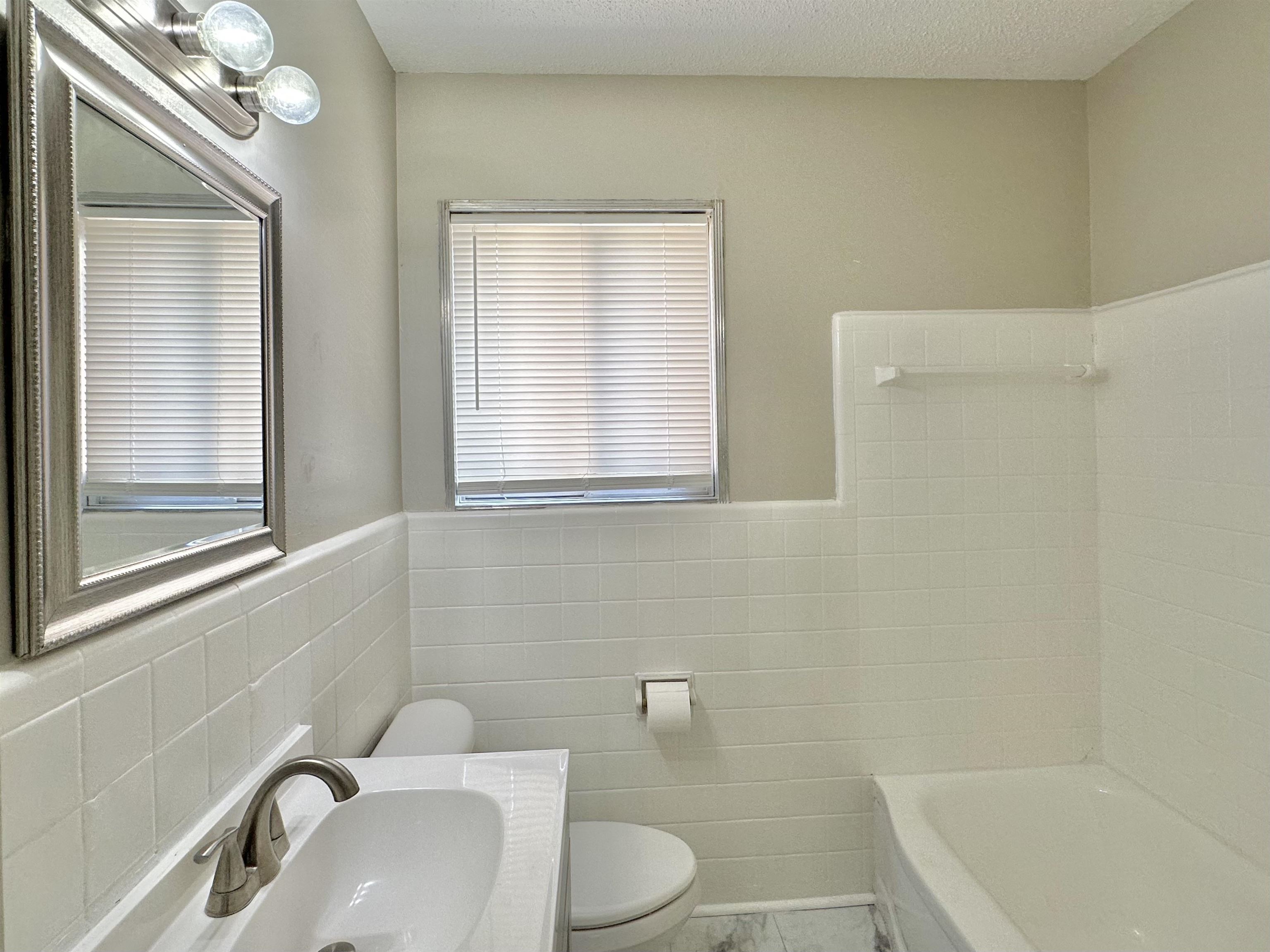 141 North White Station Road Memphis, TN 38117 - Photo 21 of 24 a bathroom with a sink a toilet and bathtub