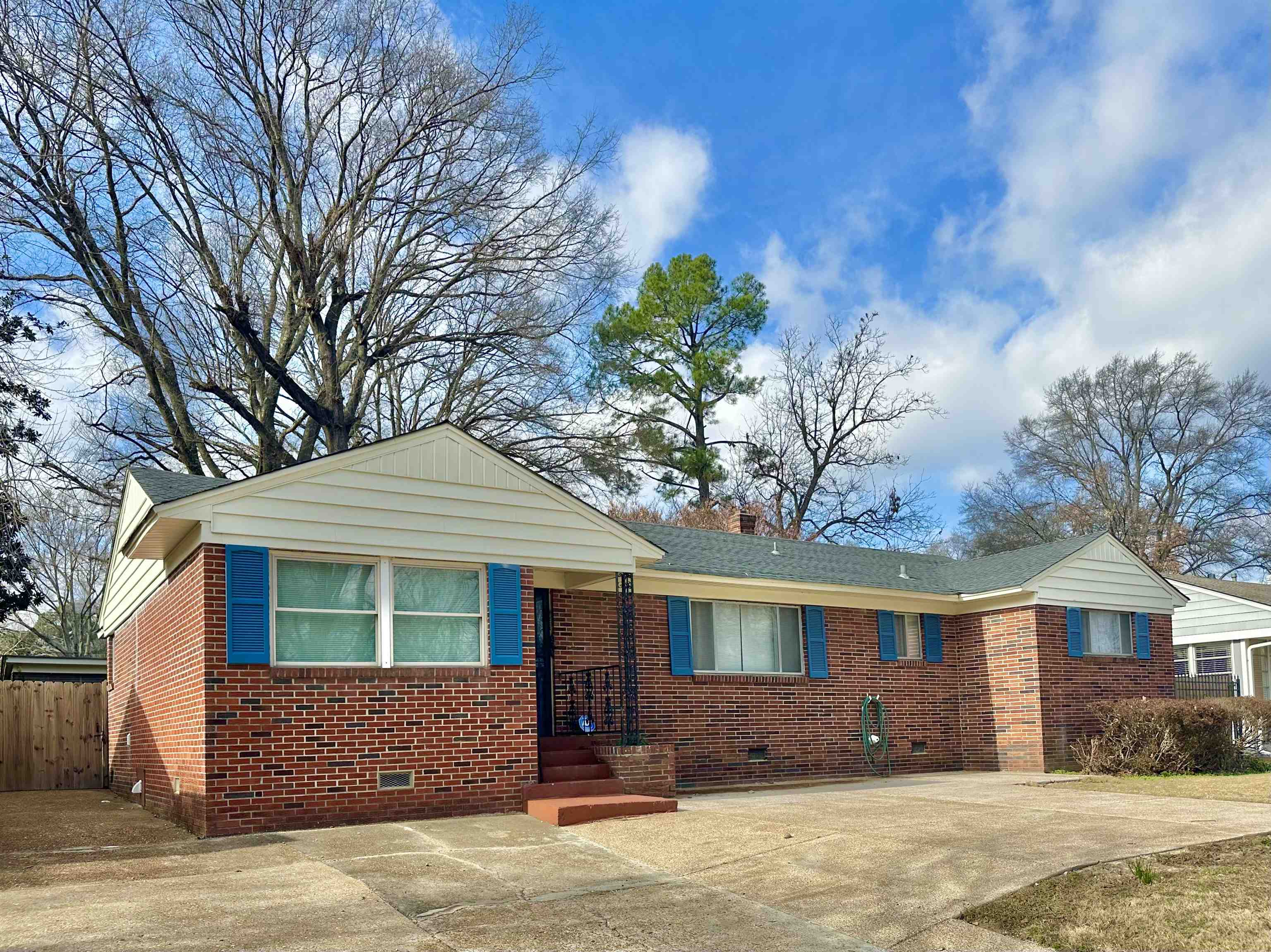 141 North White Station Road Memphis, TN 38117 - Photo 6 of 24 a front view of a house with a yard and garage