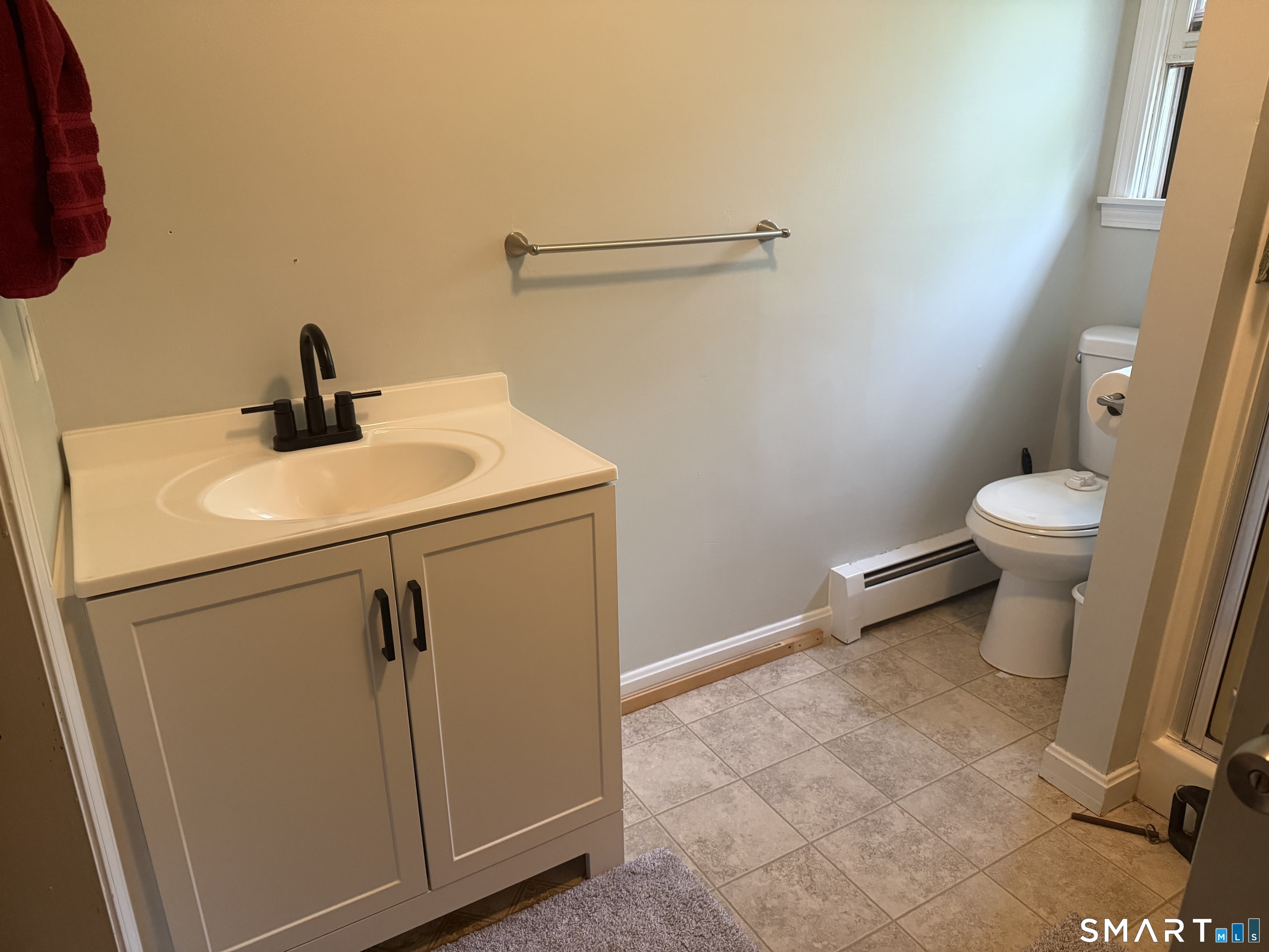 71 Mountain Road Hartland, CT 06027 - Photo 6 of 8 a close view of a sink and a toilet in a bathroom