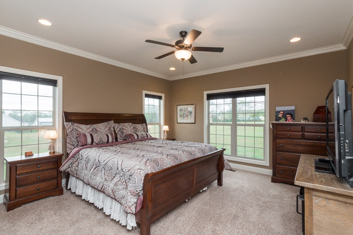855 Philadelphia Road Lebanon, TN 37087 - Photo 20 of 30 a bedroom with a bed and a chandelier