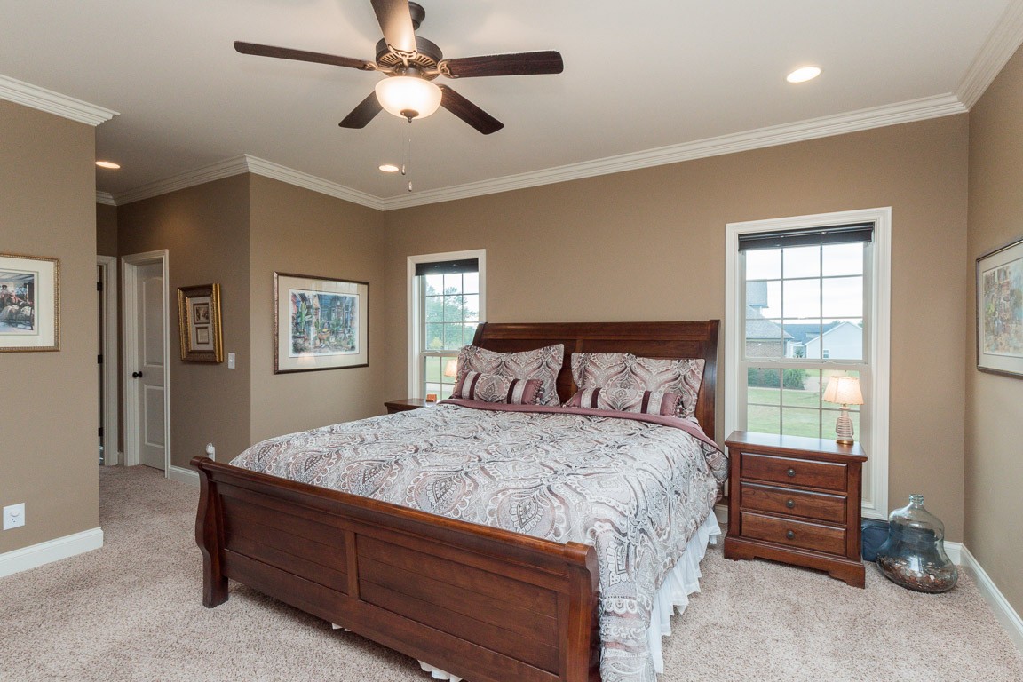 855 Philadelphia Road Lebanon, TN 37087 - Photo 21 of 30 a bedroom with a bed and a chandelier