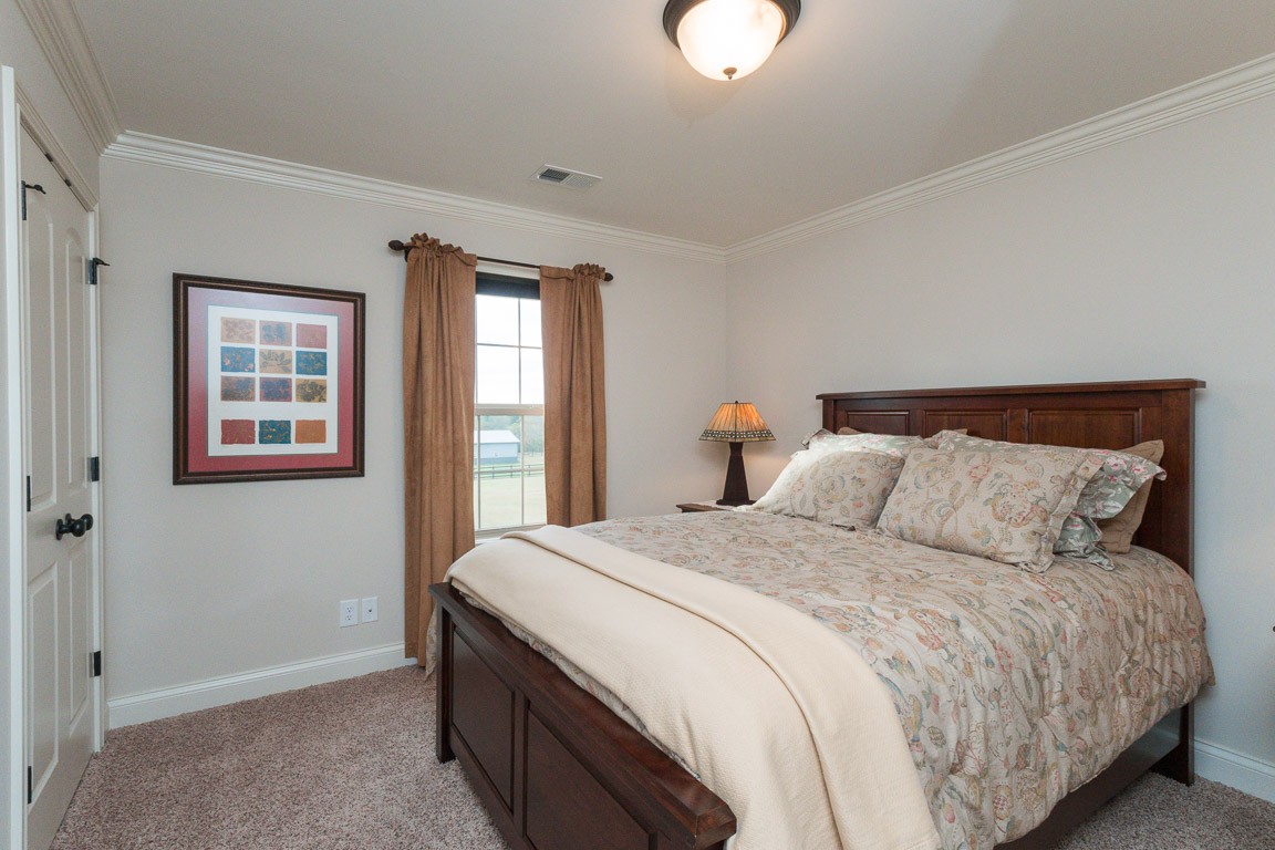 855 Philadelphia Road Lebanon, TN 37087 - Photo 24 of 30 a bedroom with a large bed and a window