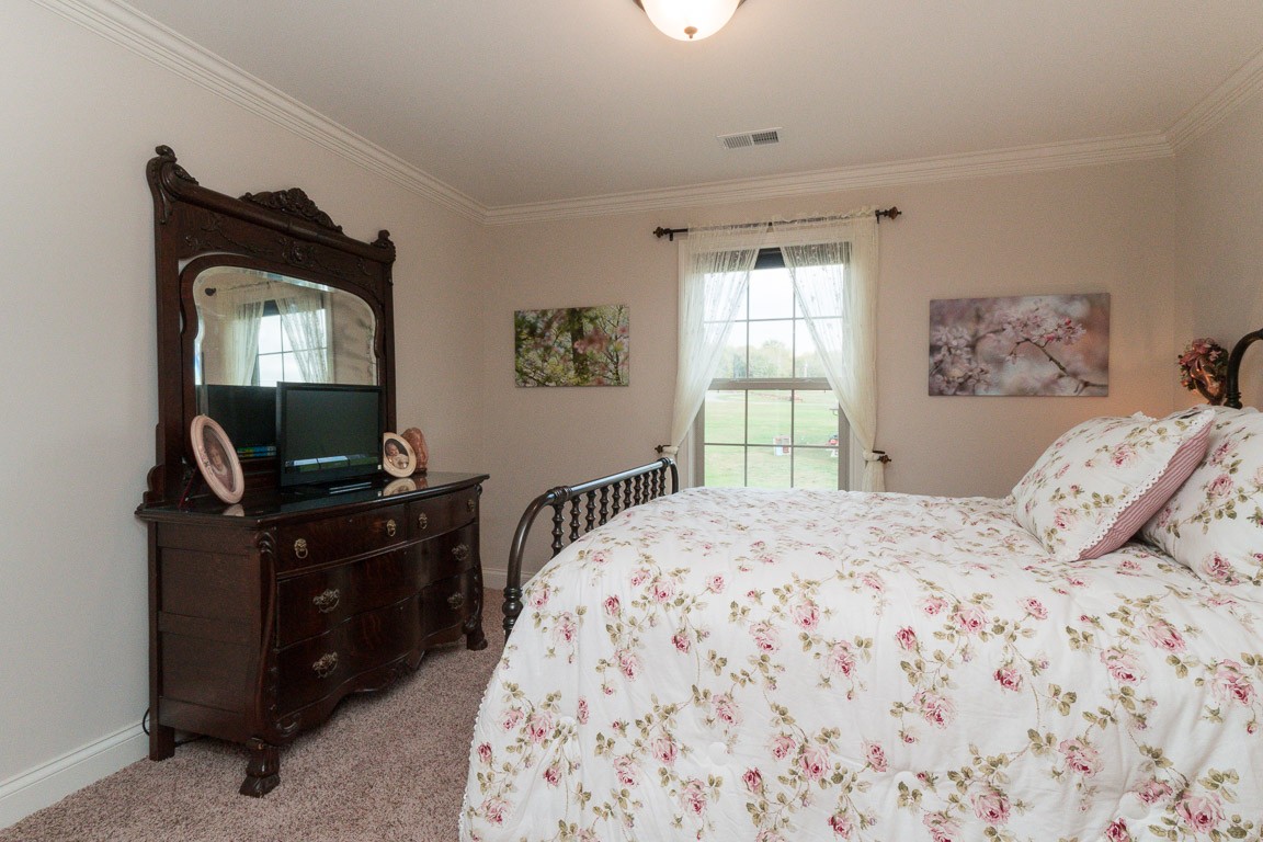 855 Philadelphia Road Lebanon, TN 37087 - Photo 27 of 30 a bedroom with a bed and a window