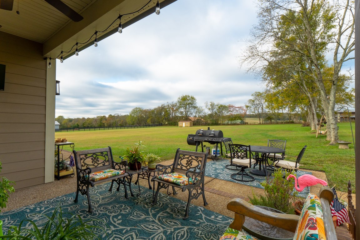 855 Philadelphia Road Lebanon, TN 37087 - Photo 7 of 30 a view of a patio with furniture and a lake view